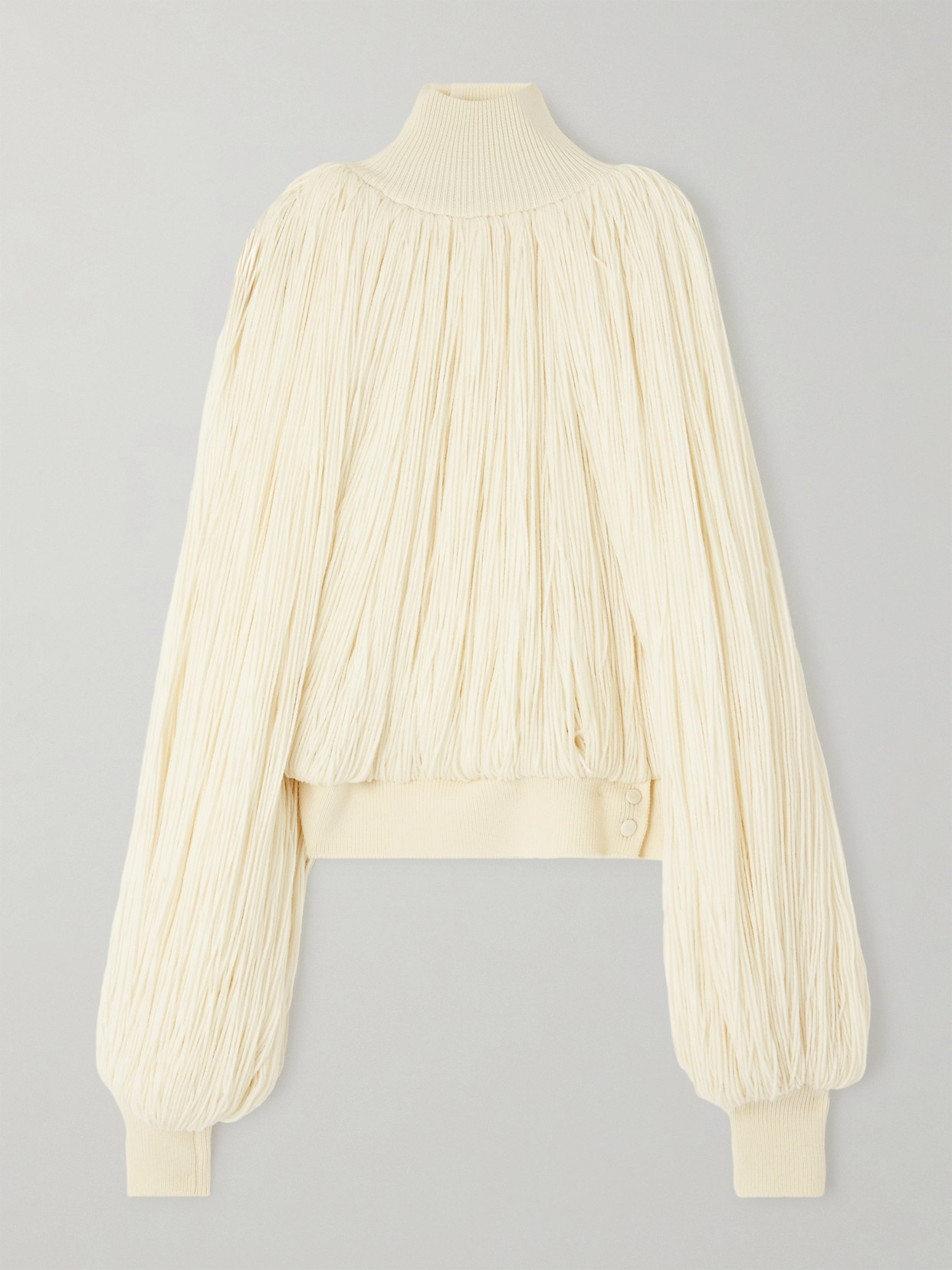 ALAÏA FRINGED WOOL-BLEND TURTLENECK TOP