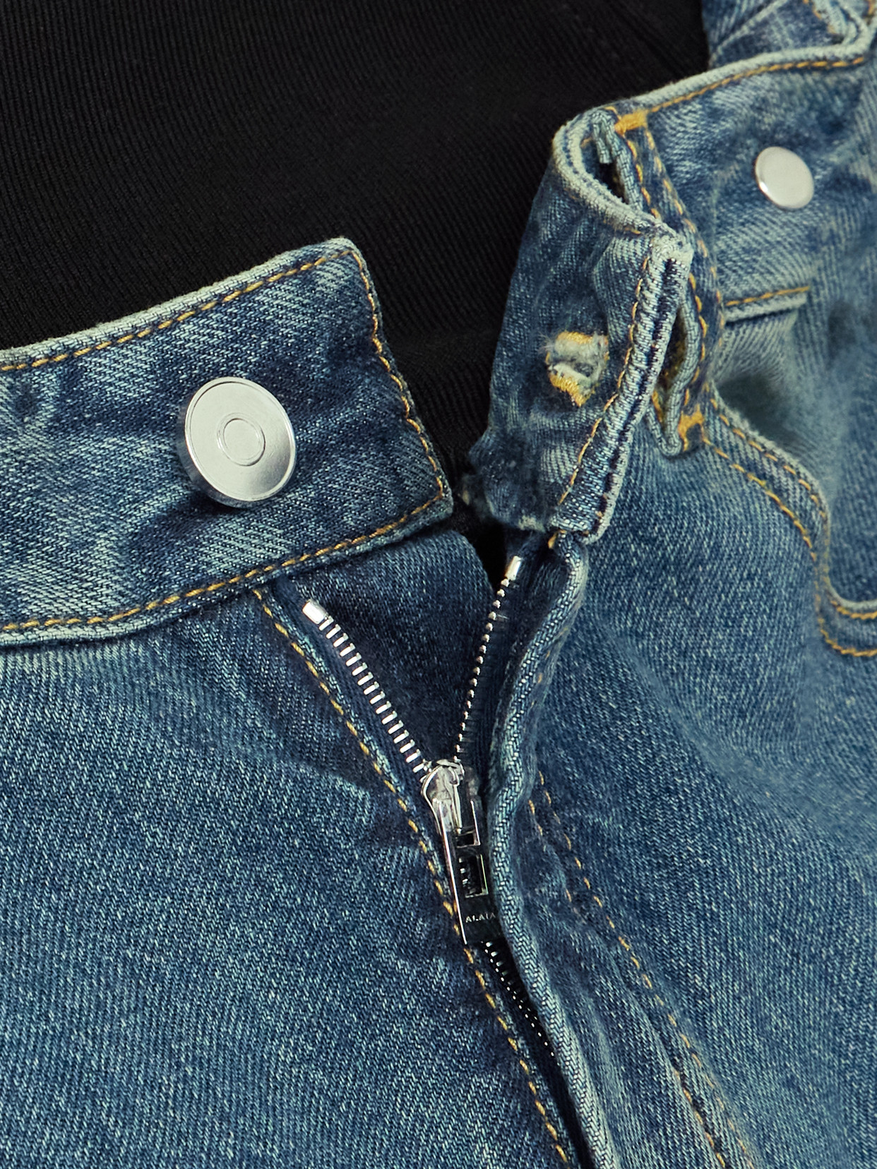 Alaïa Studded Jersey-trimmed High-rise Wide-leg Jeans In Blue