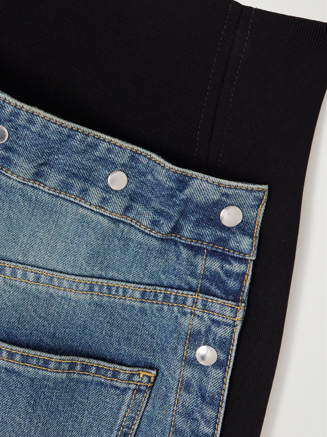 Alaïa Studded Jersey-trimmed High-rise Wide-leg Jeans In Blue