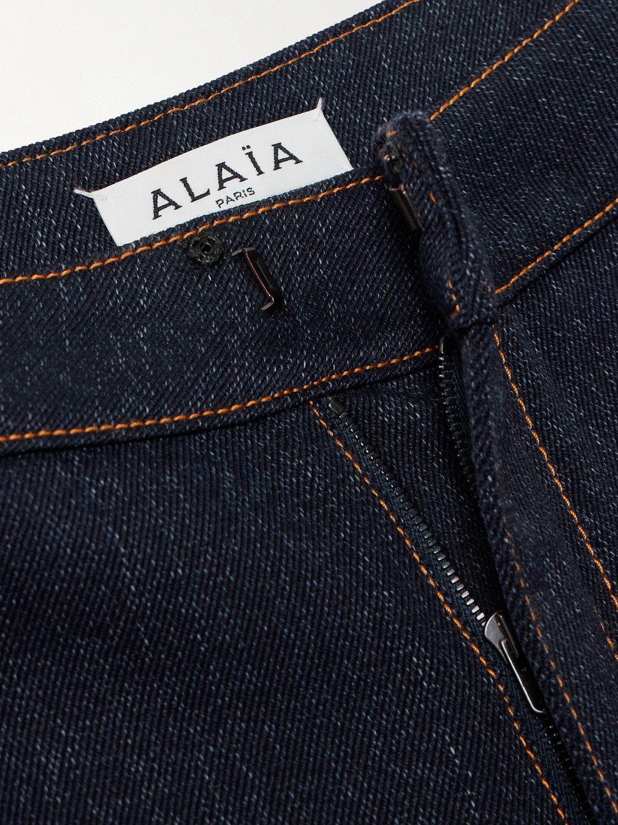 Shop Alaïa Layered Low-rise Wide-leg Jeans In Blue