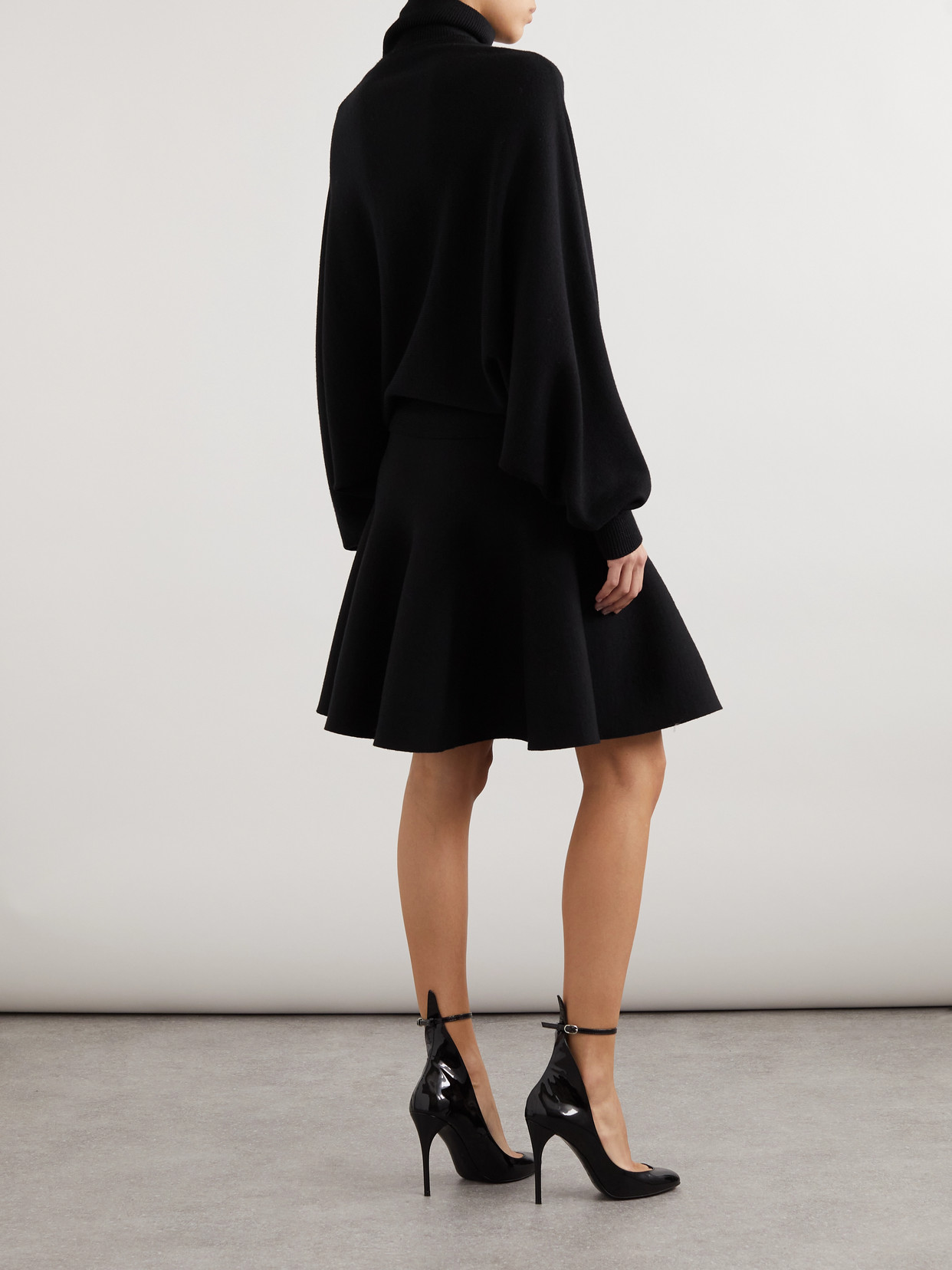 ALAÏA PLEATED VIRGIN WOOL AND WOOL-BLEND TURTLENECK MINI DRESS