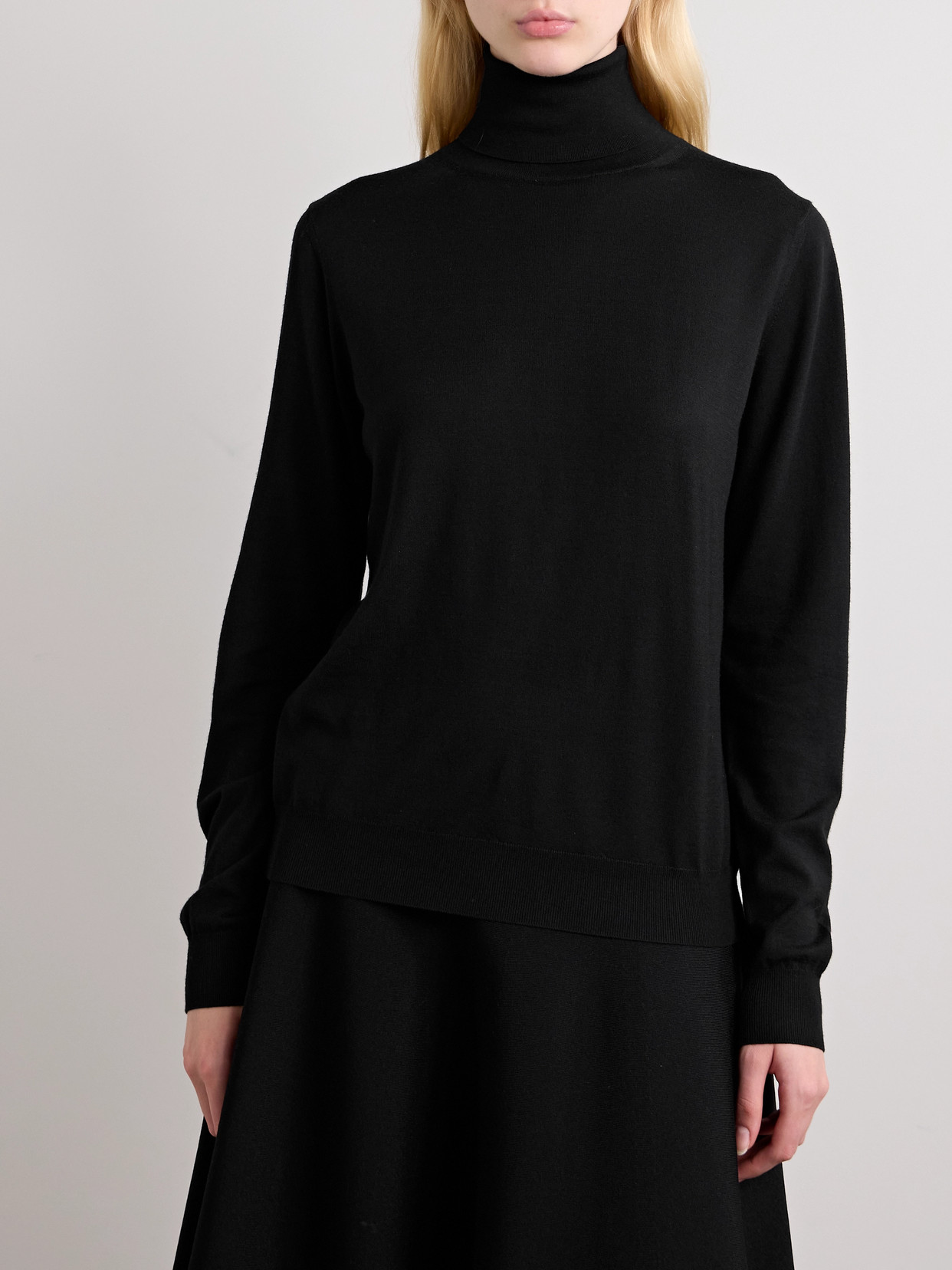 The Row Heva Wool-jersey Turtleneck Sweater In Black