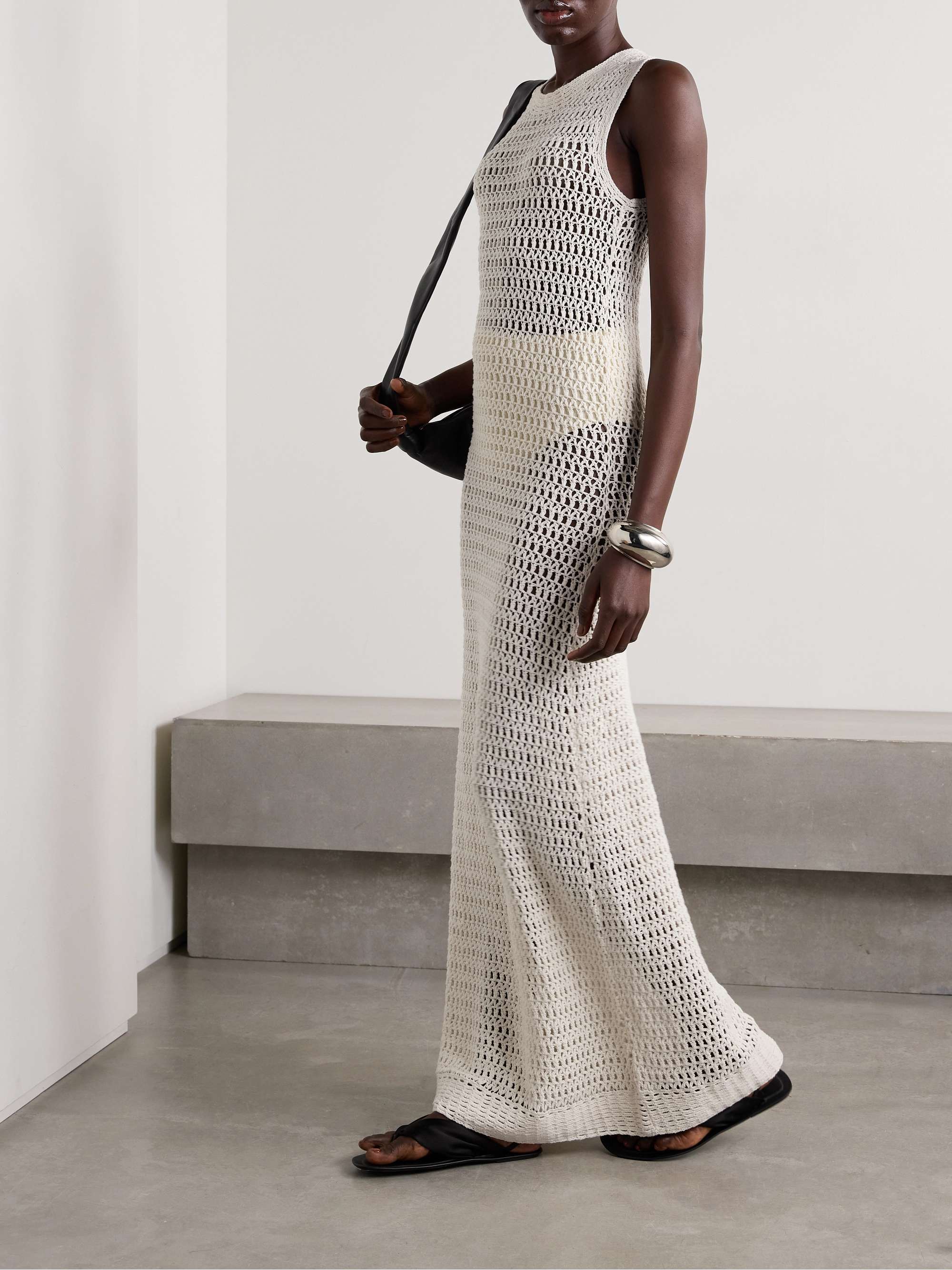 LESET's 'Lucy' maxi dress is intricately crocheted from soft cotton - the open construction makes it perfect for layering over a tonal slip or swimsuit. It has a figure-hugging fit and floor-grazing hem.