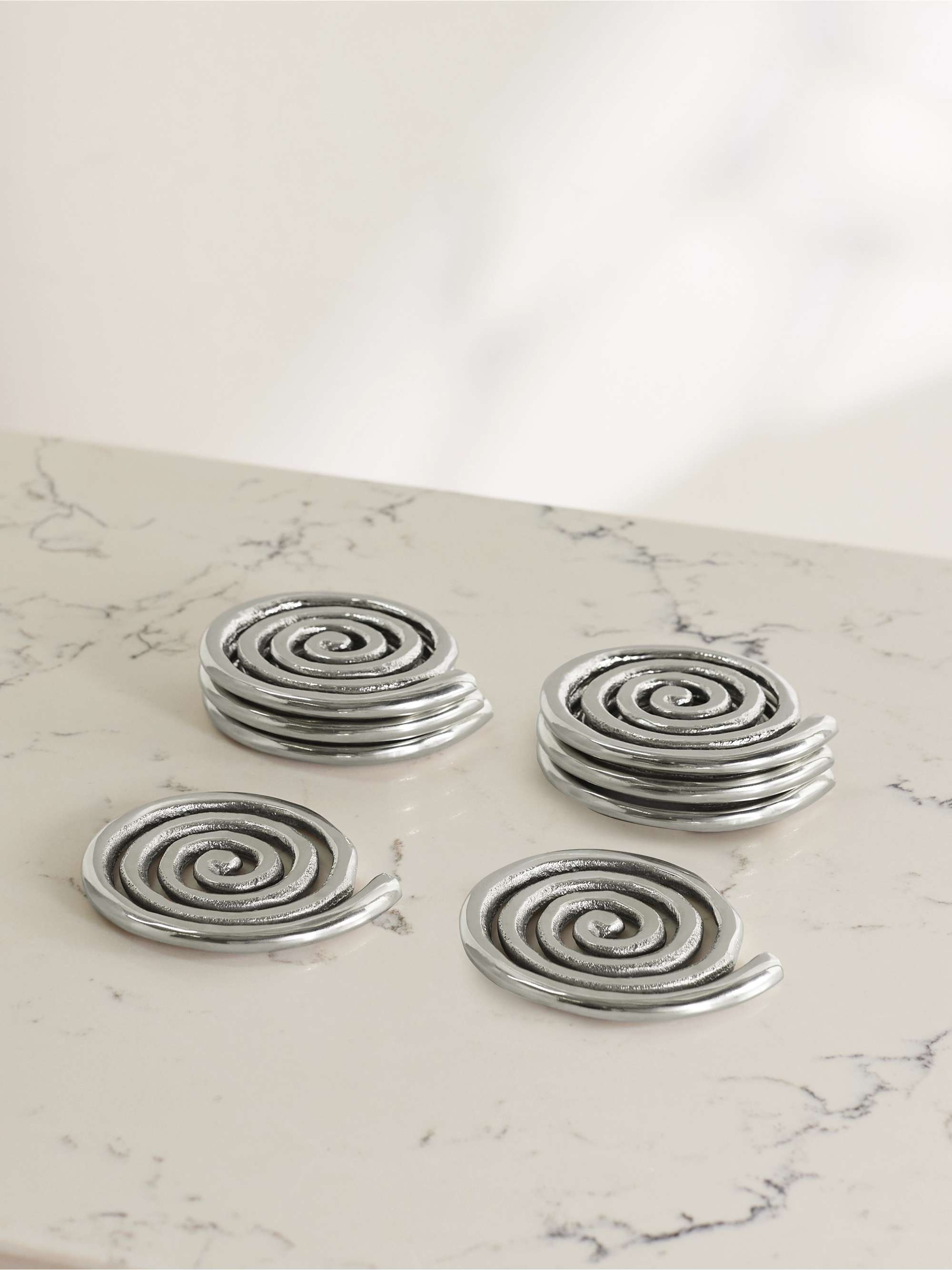 SOPHIE LOU JACOBSEN Spiral set of 8 nickel-plated coasters