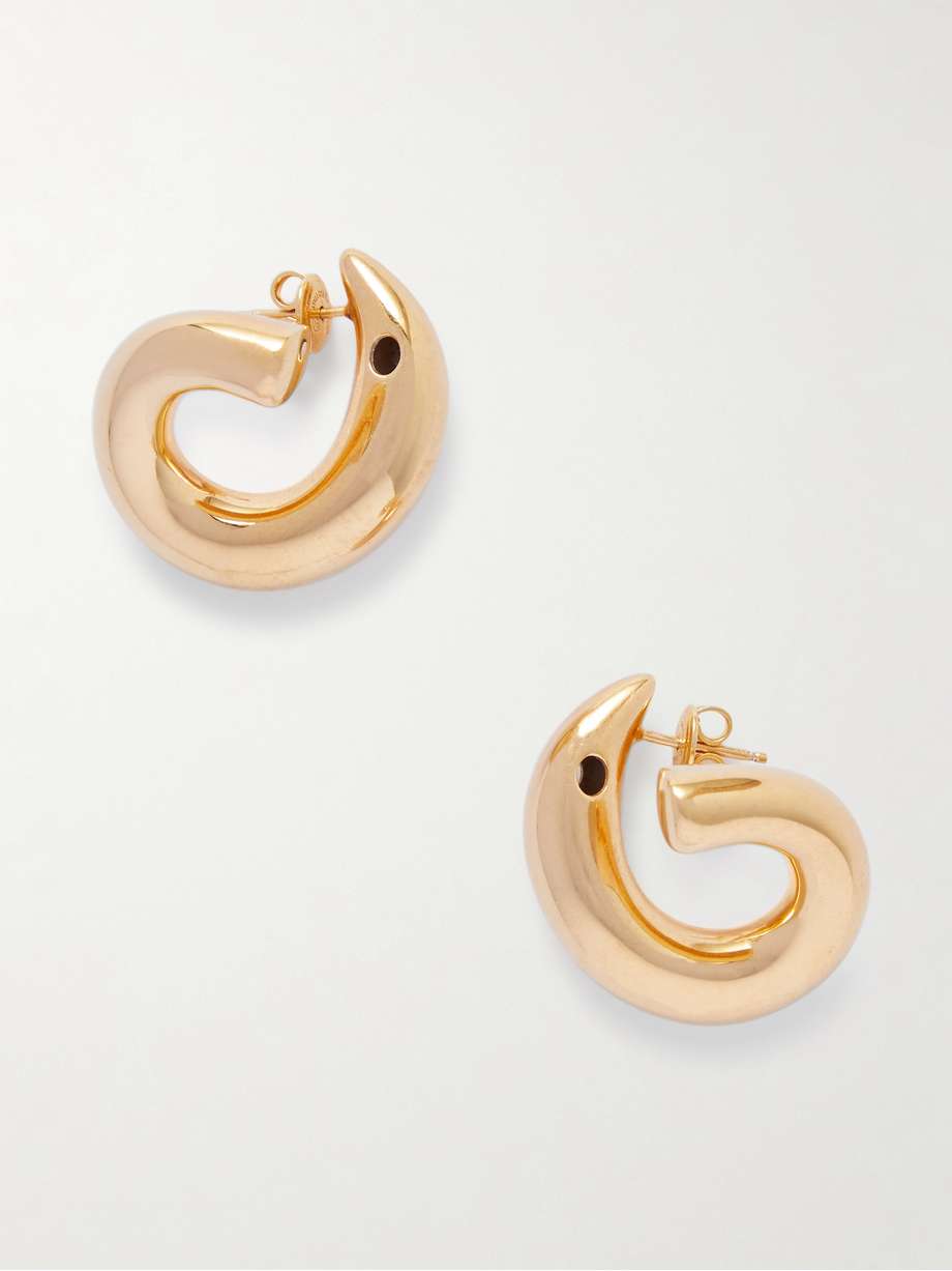 Bottega Veneta's 'Sardine' earrings nod to the sculptural handle of the house's bag of the same name. They're cast in a curved shape from glossy gold-plated silver that's polished for a gorgeous shine