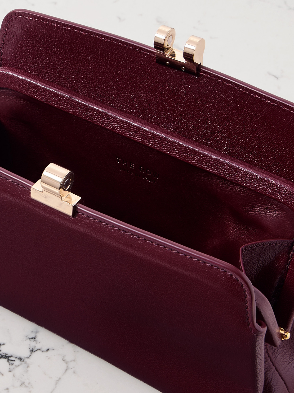 The Row Amazon Textured-leather Clutch In Burgundy