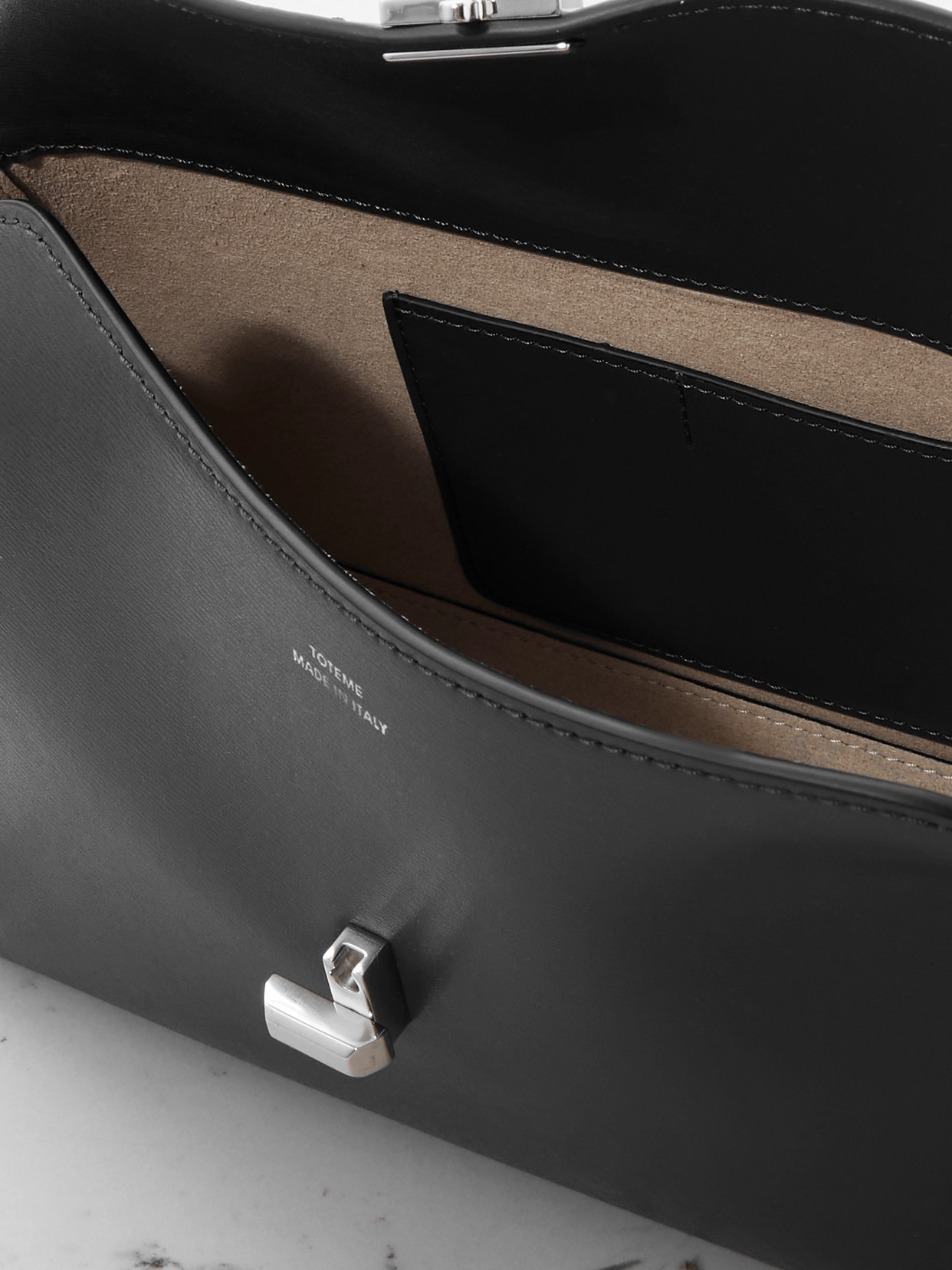 Totême T-lock Leather Clutch In Gray