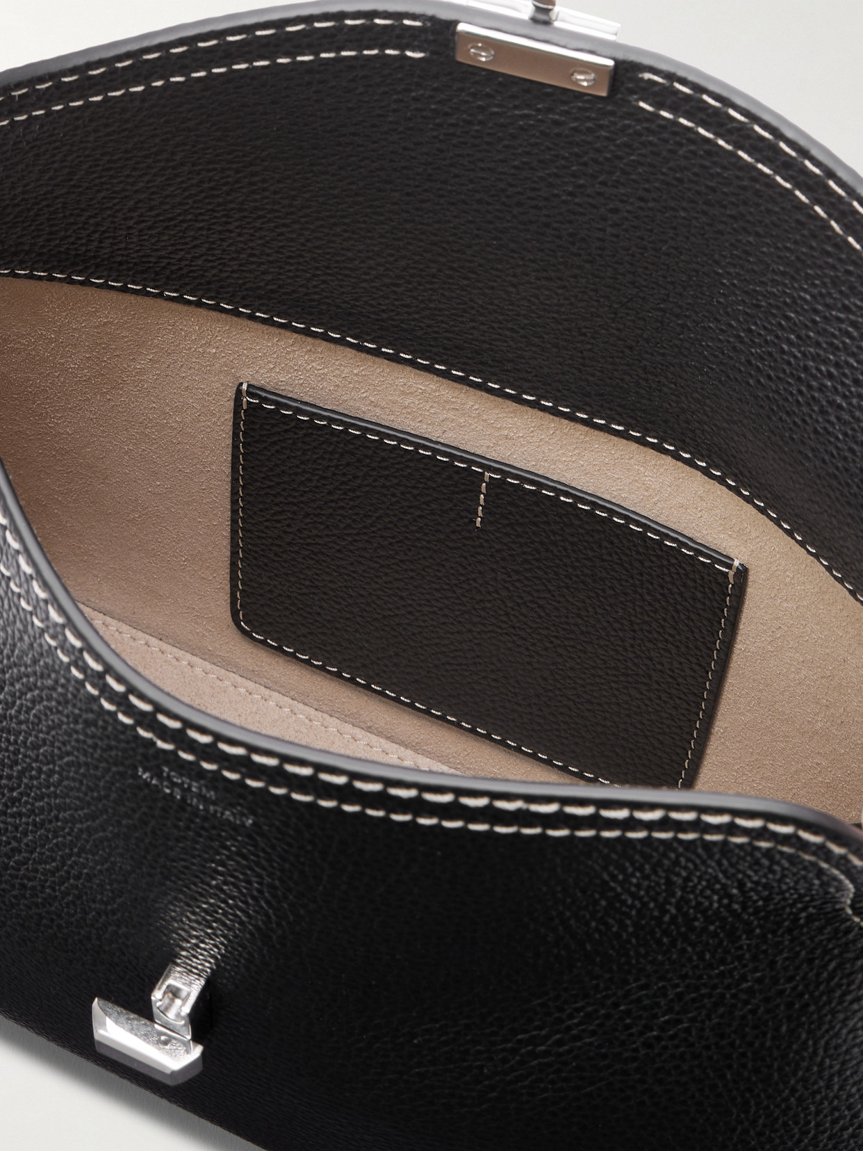 Totême T-lock Textured-leather Clutch In Black