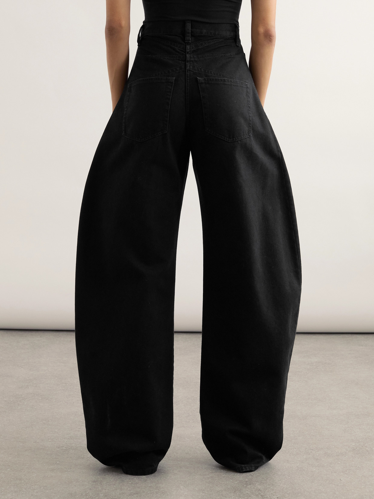 Alaïa Rounded Leg Denim Pants In Black