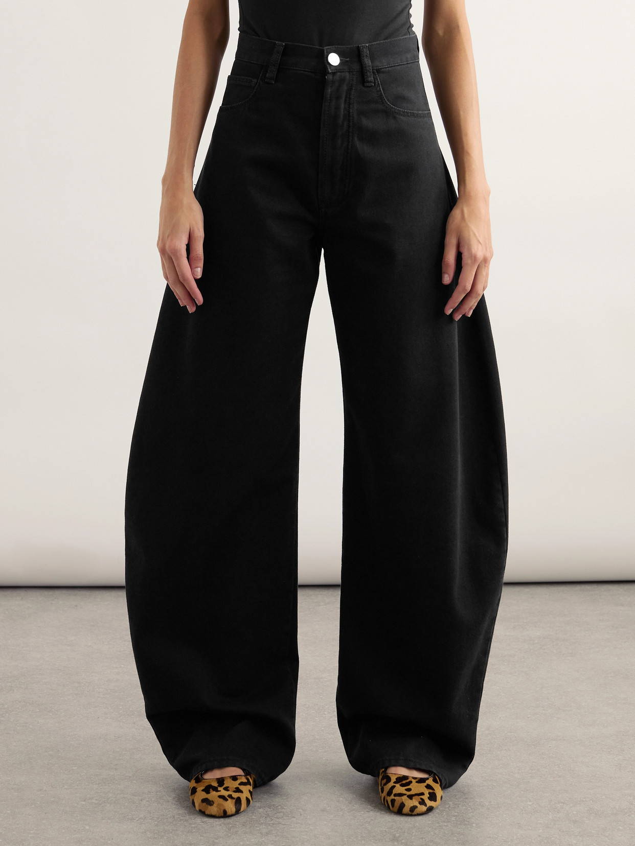 Alaïa Rounded Leg Denim Pants In Black