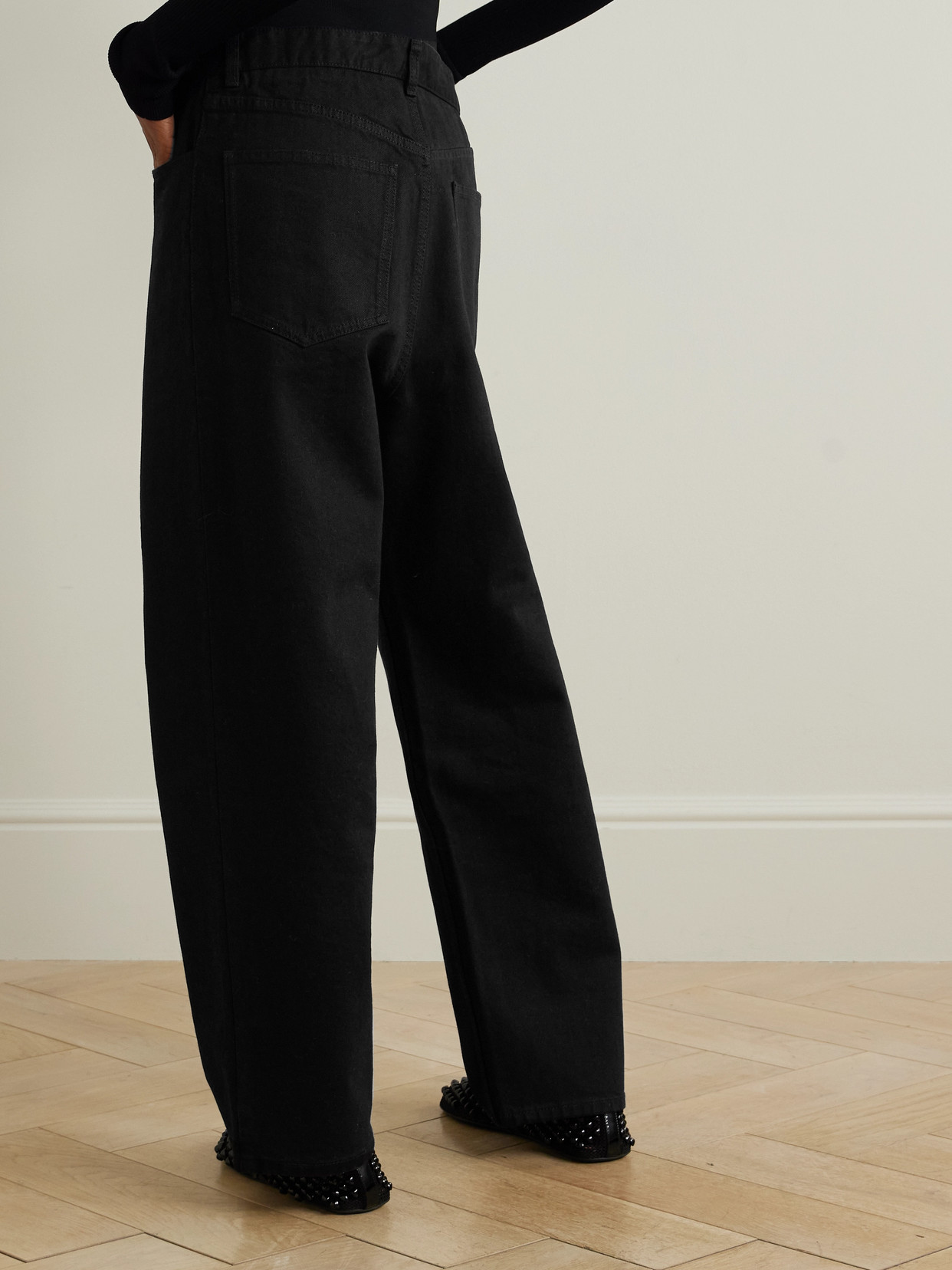 ALAÏA STRETCH KNIT-TRIMMED JEANS