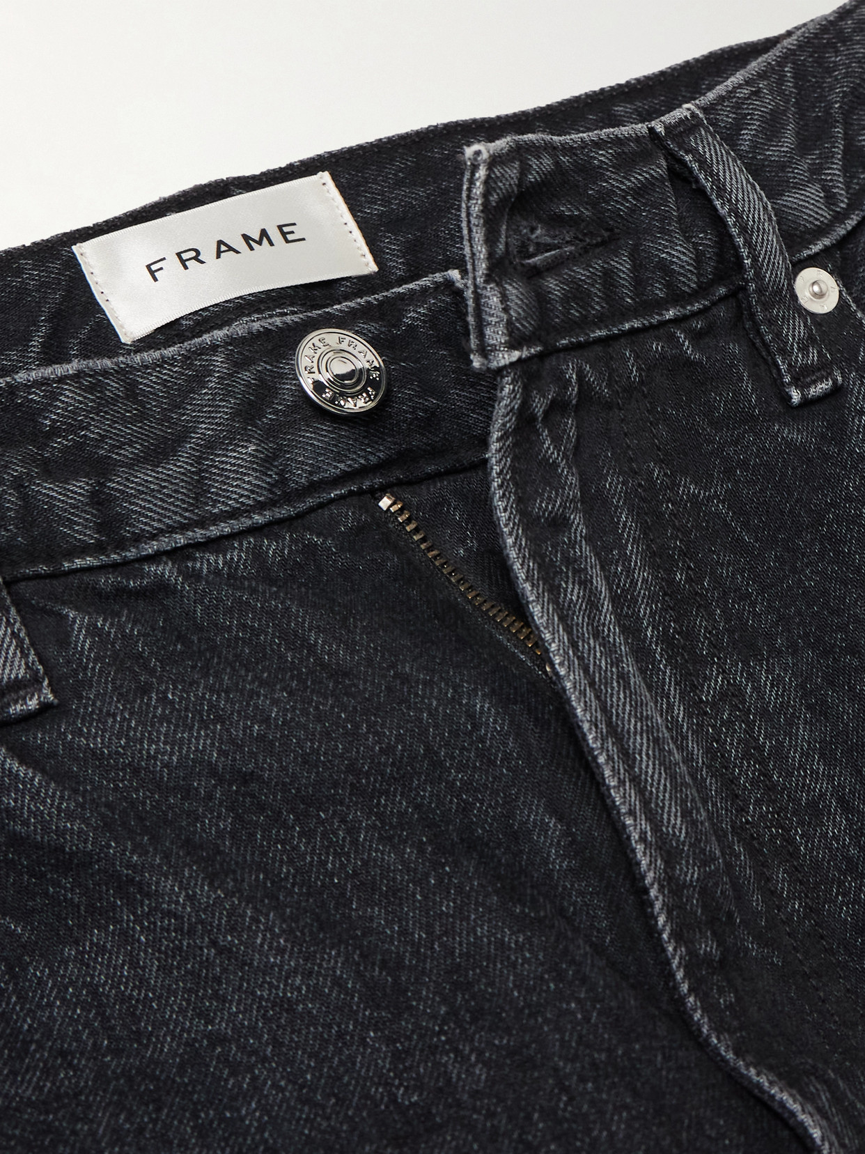Frame The Narrow Peg High-rise Tapered Jeans In Black