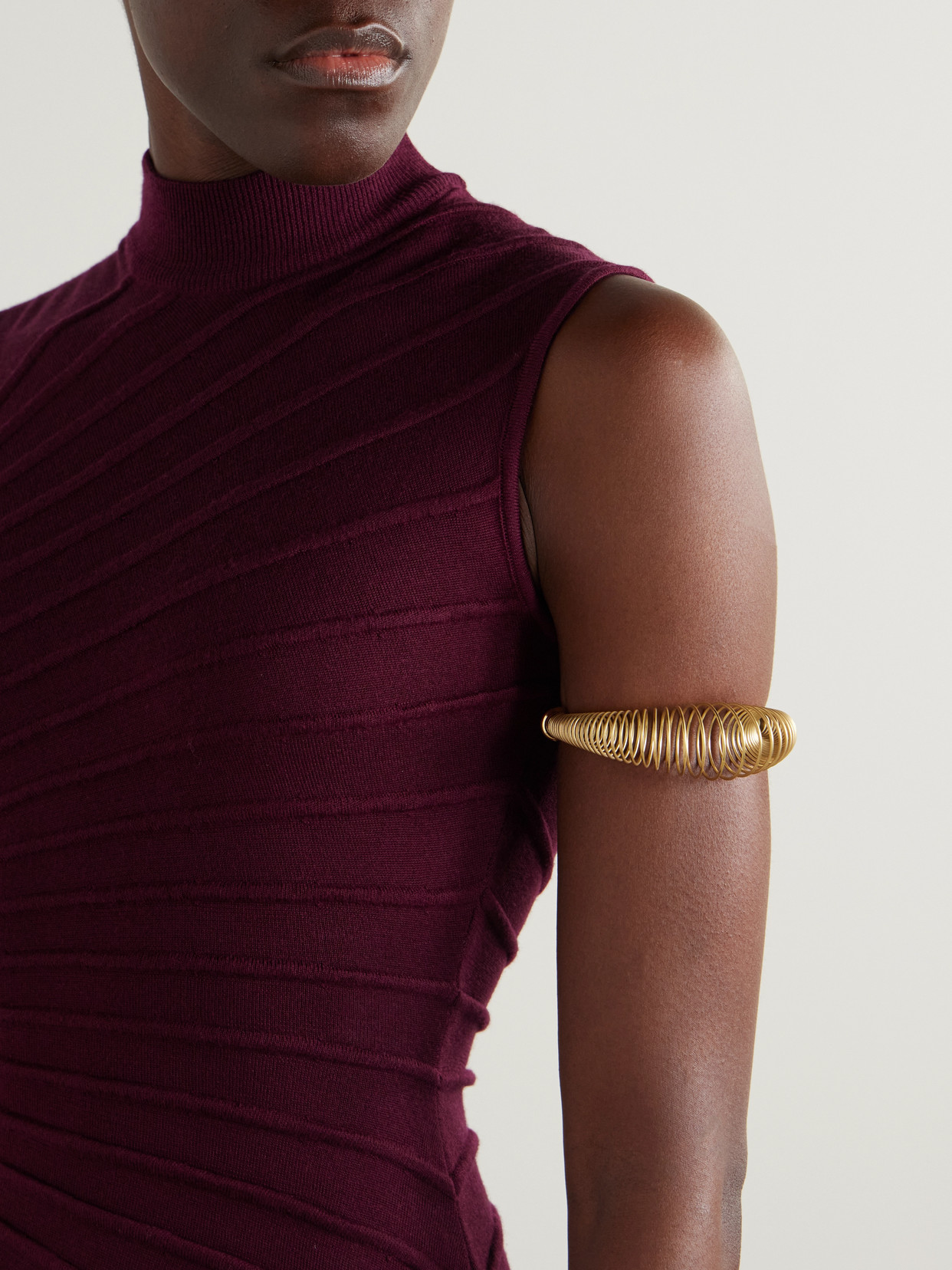 Alaïa Spiral Stainless Steel Bracelet In Gold