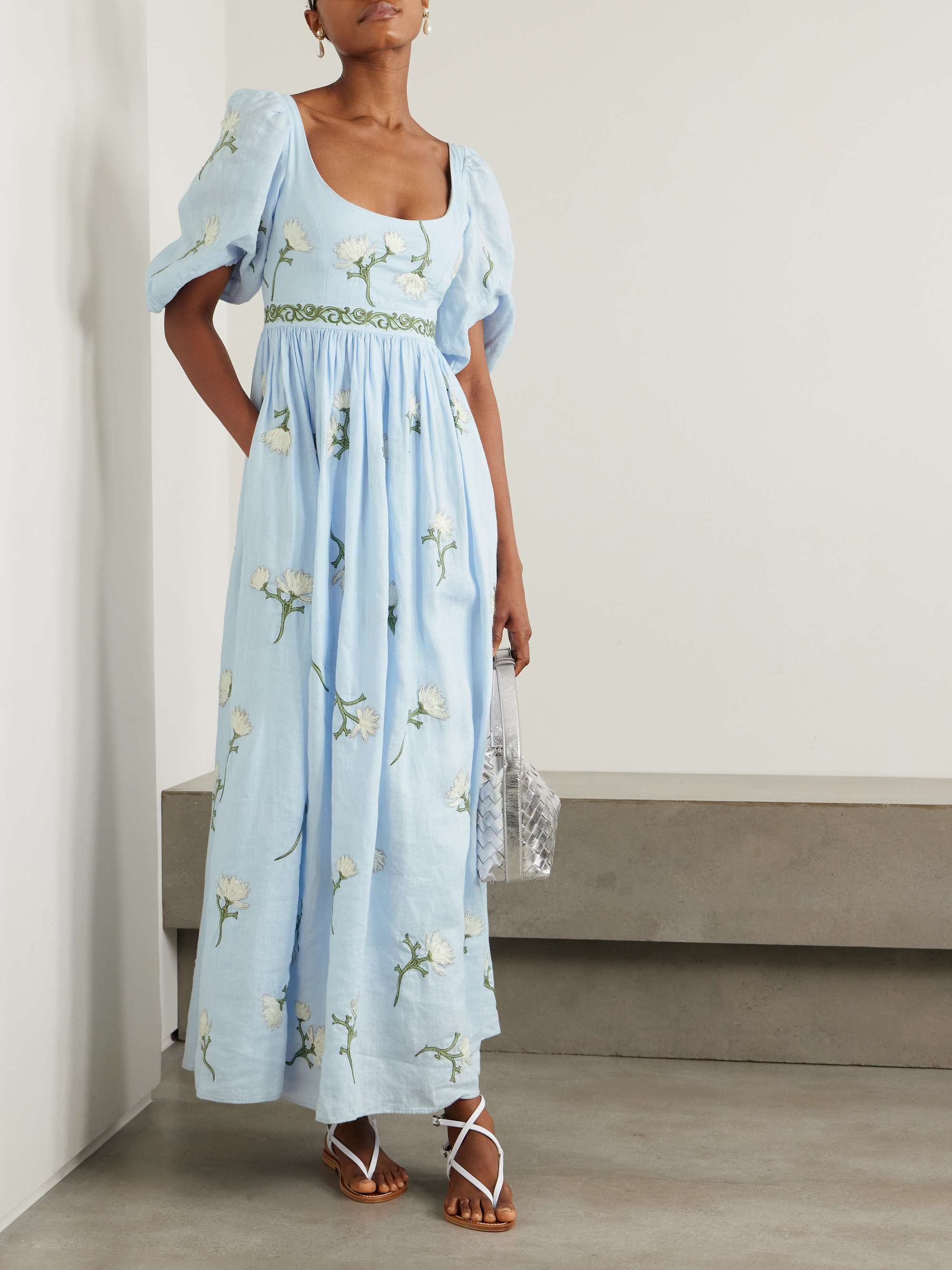 Agua by Agua Bendita's 'Viviane Soledad' dress is hand-embroidered with pretty florals and curly vines at the waist. Cut from airy linen, it has puffed sleeves with a scoop neck that's mirrored in the back. The skirt is gathered below the bust before falling to a swishy maxi hem.