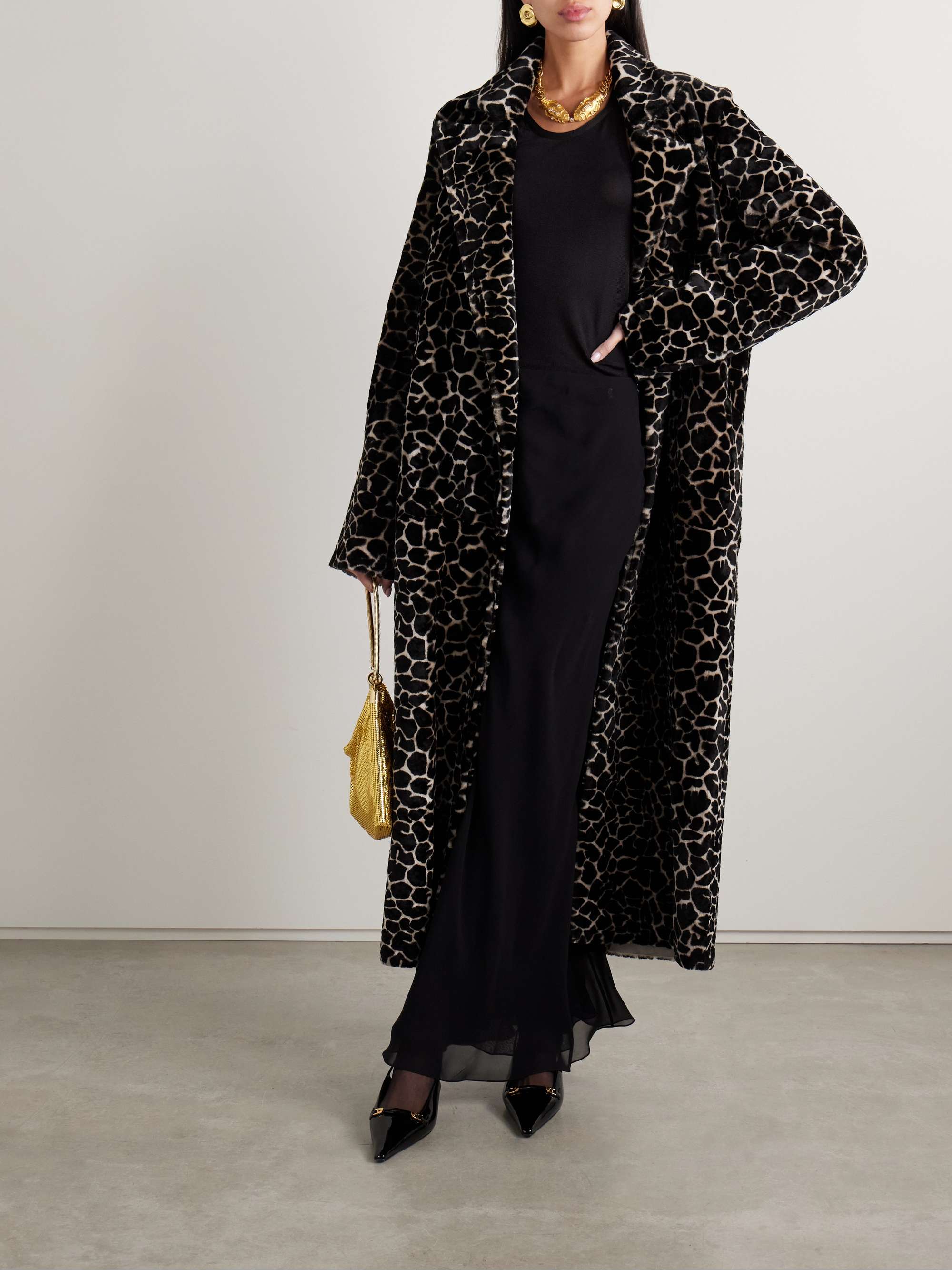 Dodo Bar Or's Resort '25 collection features an array of glamorous coats, including this 'MLP' style. Made from plush shearling, it's printed with bold leopard spots and has a relaxed, longline shape.
