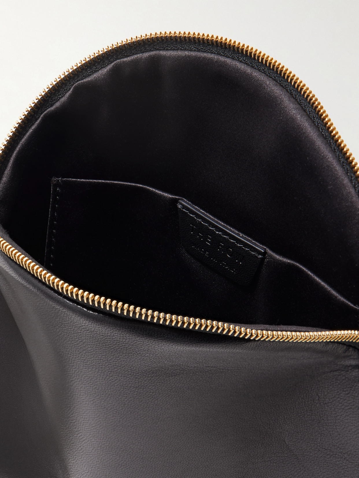 The Row Round Bracelet Matte Nappa Clutch In Black