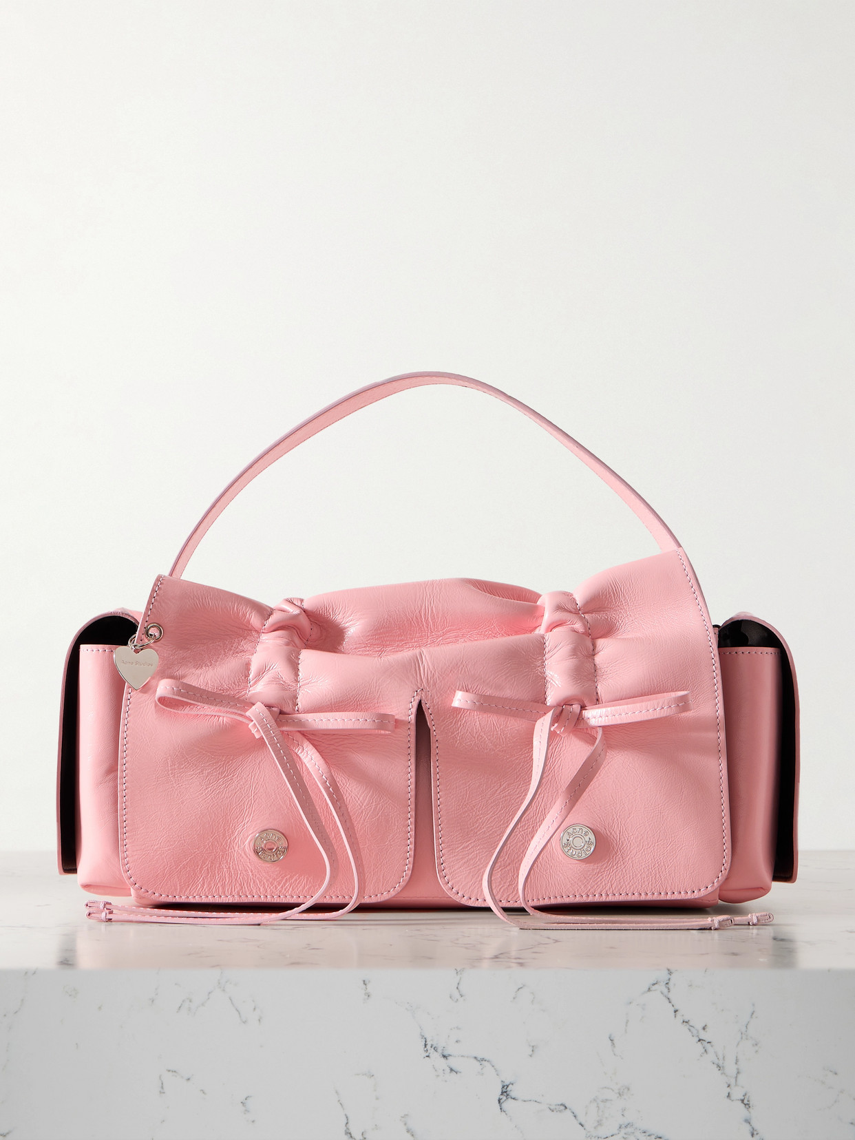 Acne Studios Multipocket Bow-detailed Ruched Leather Shoulder Bag In Pink