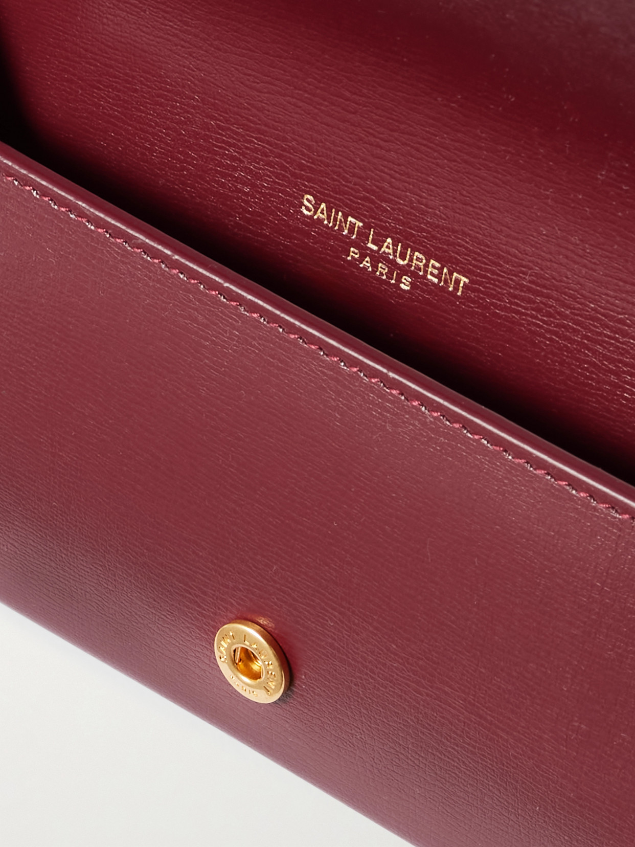 Saint Laurent Cassandre Strap Textured-leather Phone Case In Burgundy