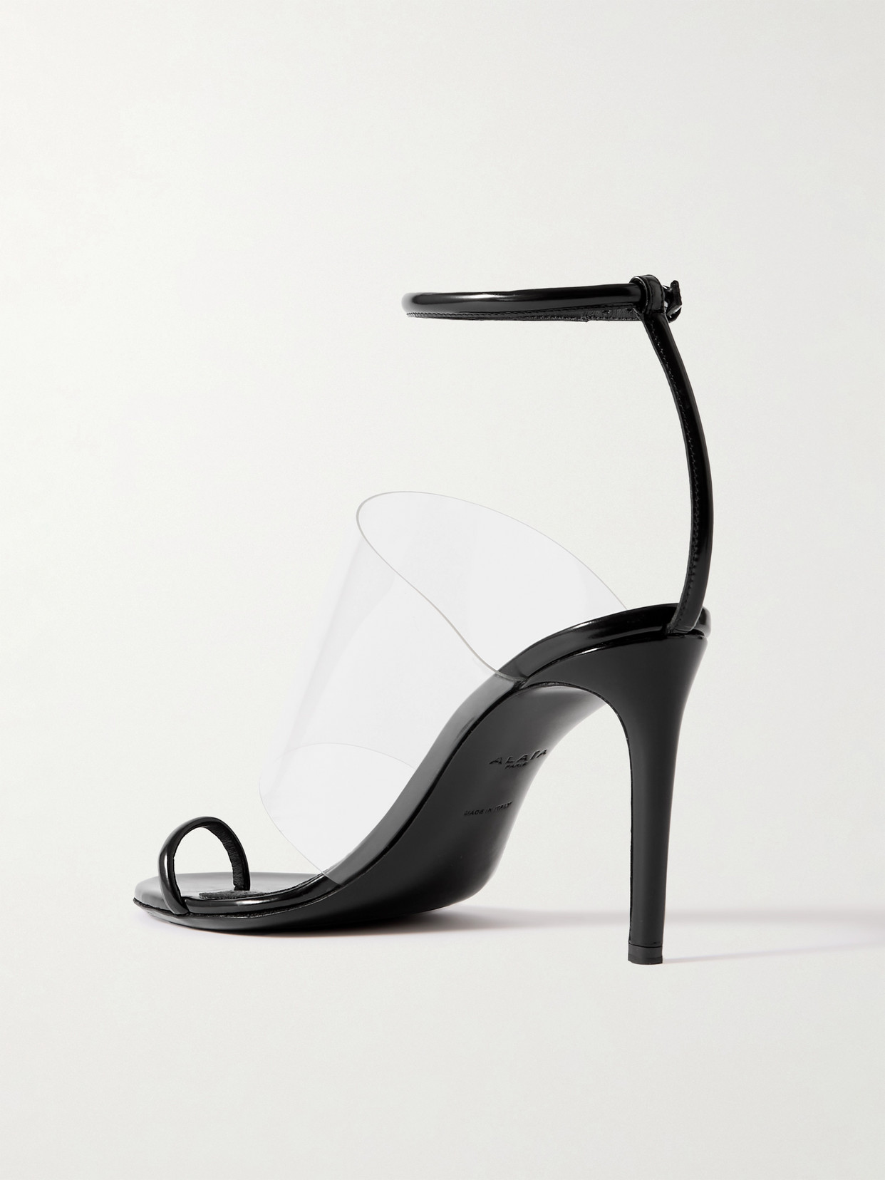 Shop Alaïa Asymmetric Patent-leather And Pvc Sandals In Black