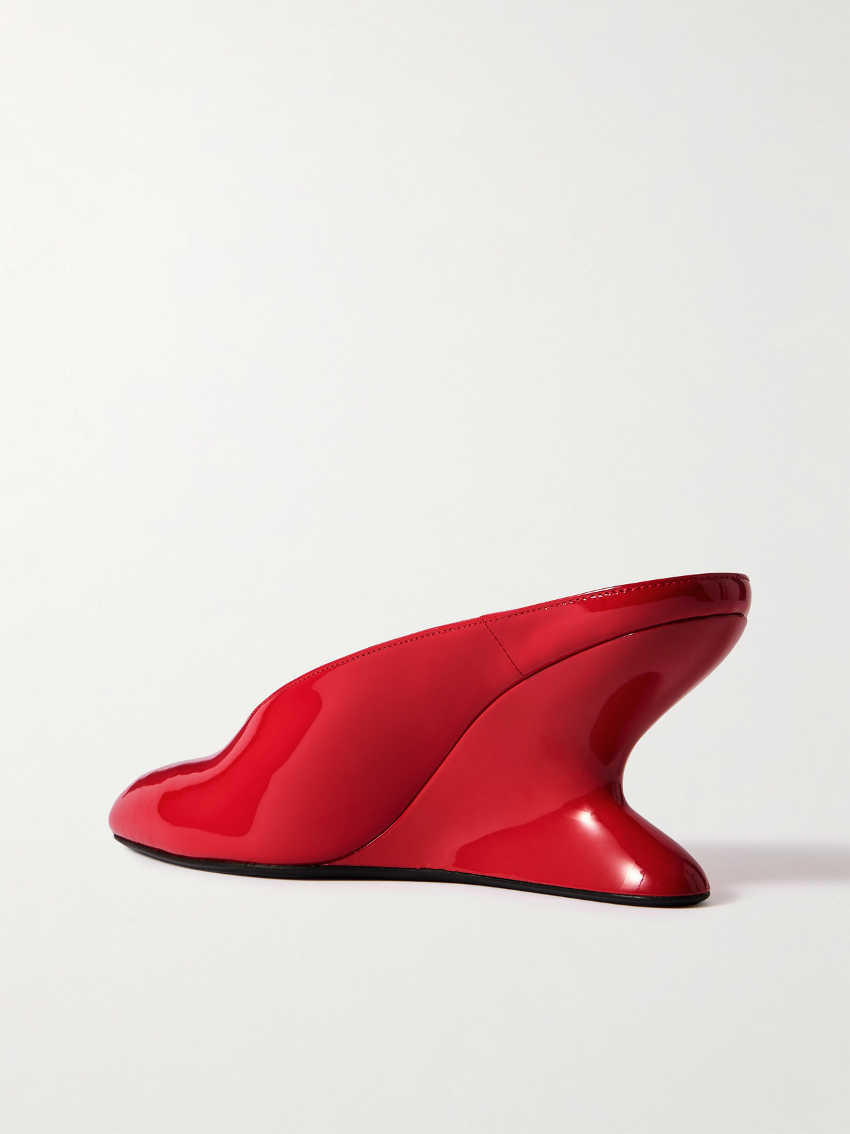 Shop Alaïa Patent-leather Wedge Mules In Red