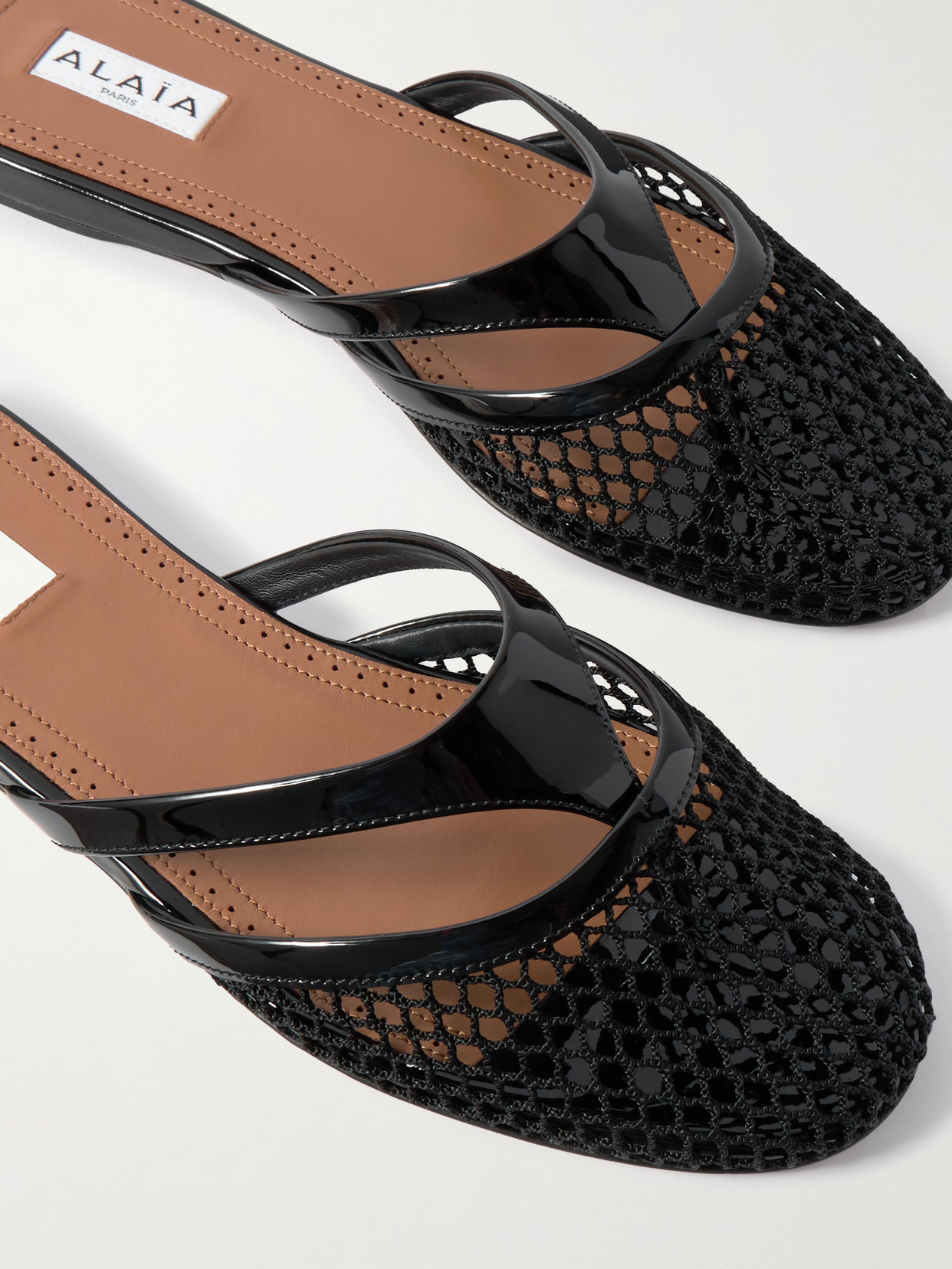 Shop Alaïa Patent-leather Trimmed Fishnet Mules In Black