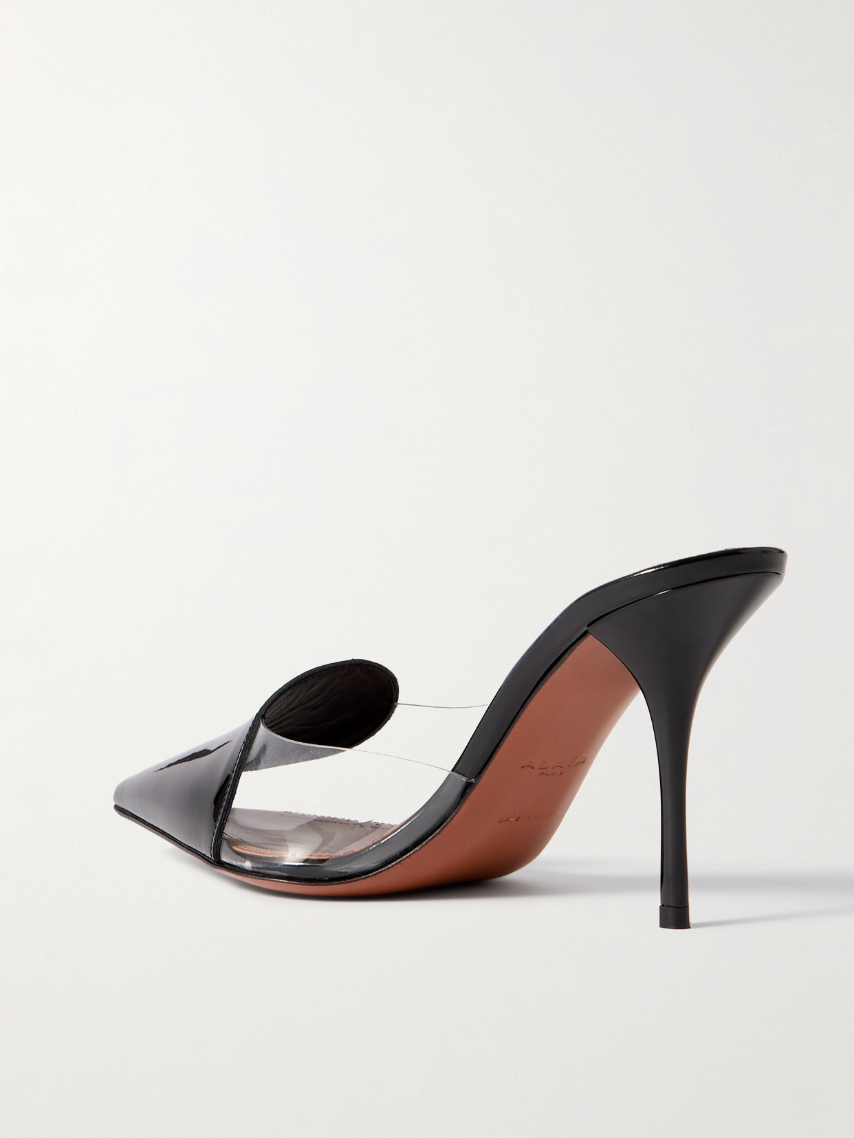 Shop Alaïa 90 Pvc And Patent-leather Mules In Black