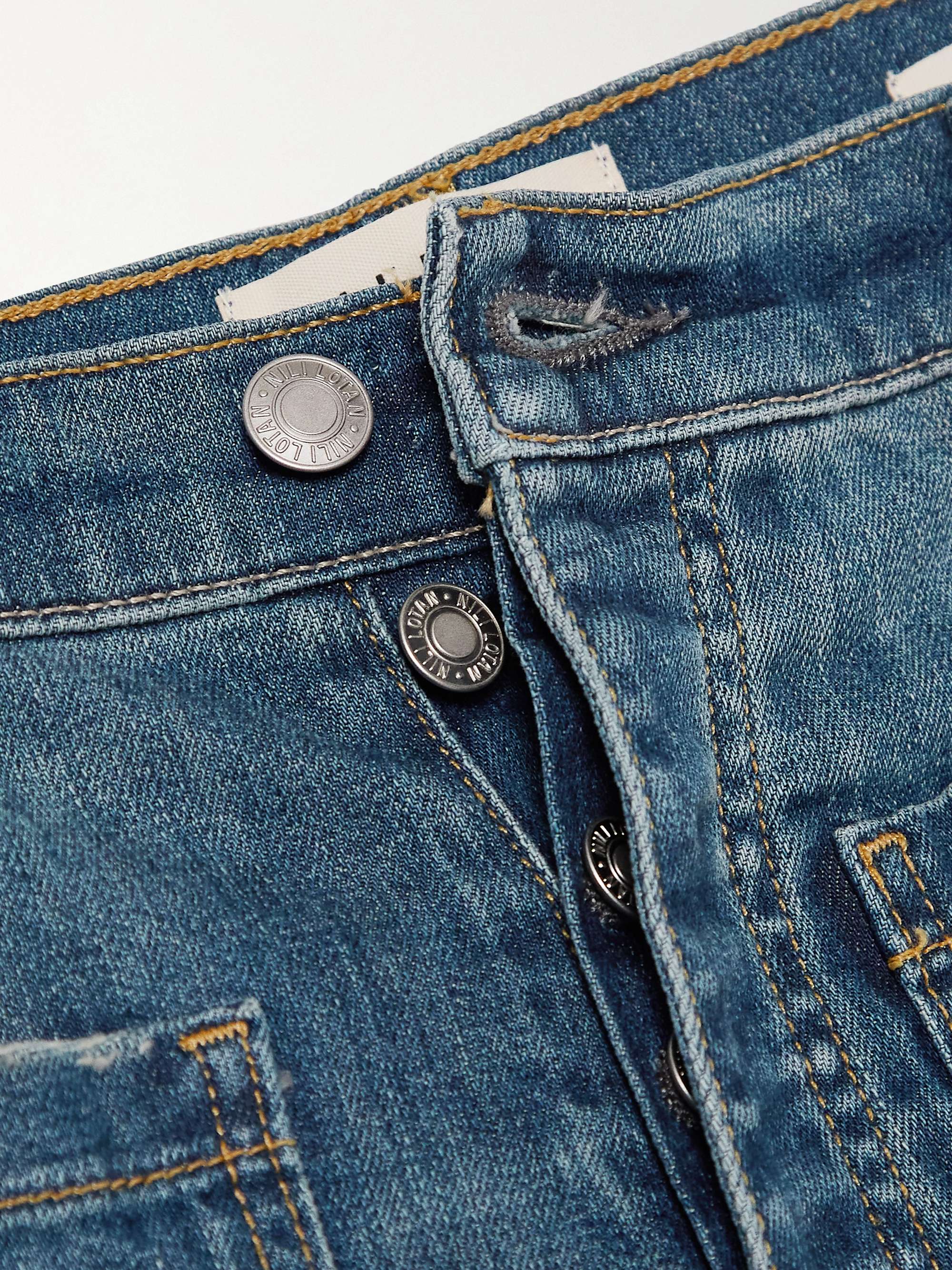 NILI LOTAN Florence distressed high-rise flared jeans
