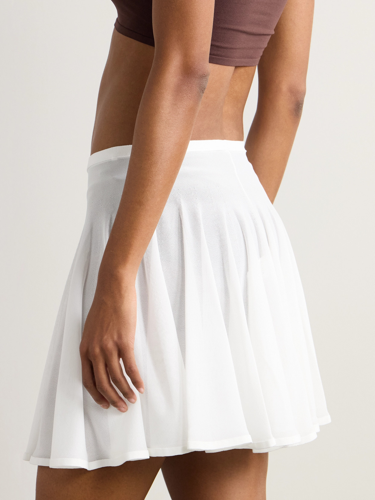 Shop Alaïa Pleated Jersey Mini Skirt In White