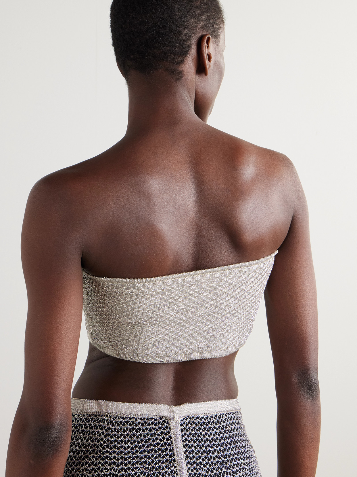 Alaïa Cropped Metallic Open-knit Bandeau Top In Silver