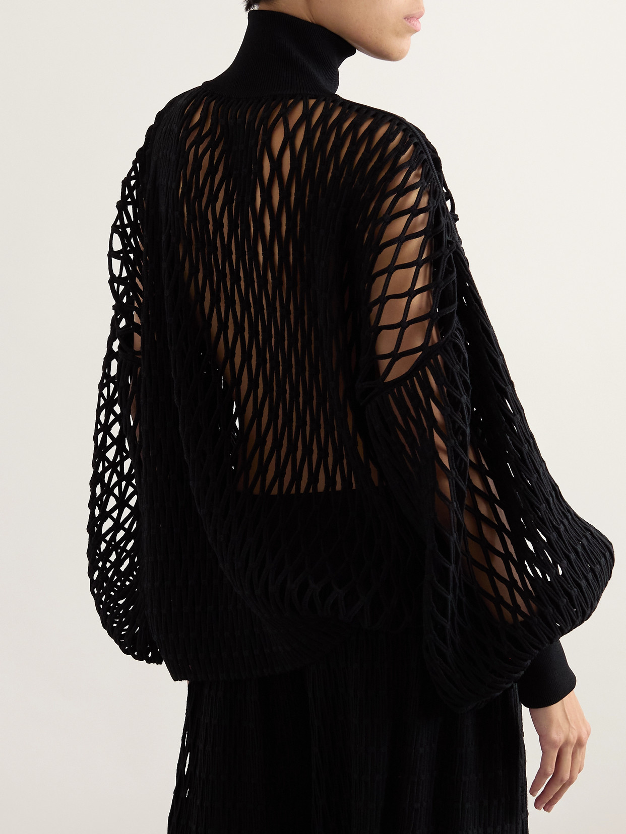 ALAÏA OVERSIZED OPEN-KNIT TURTLENECK SWEATER