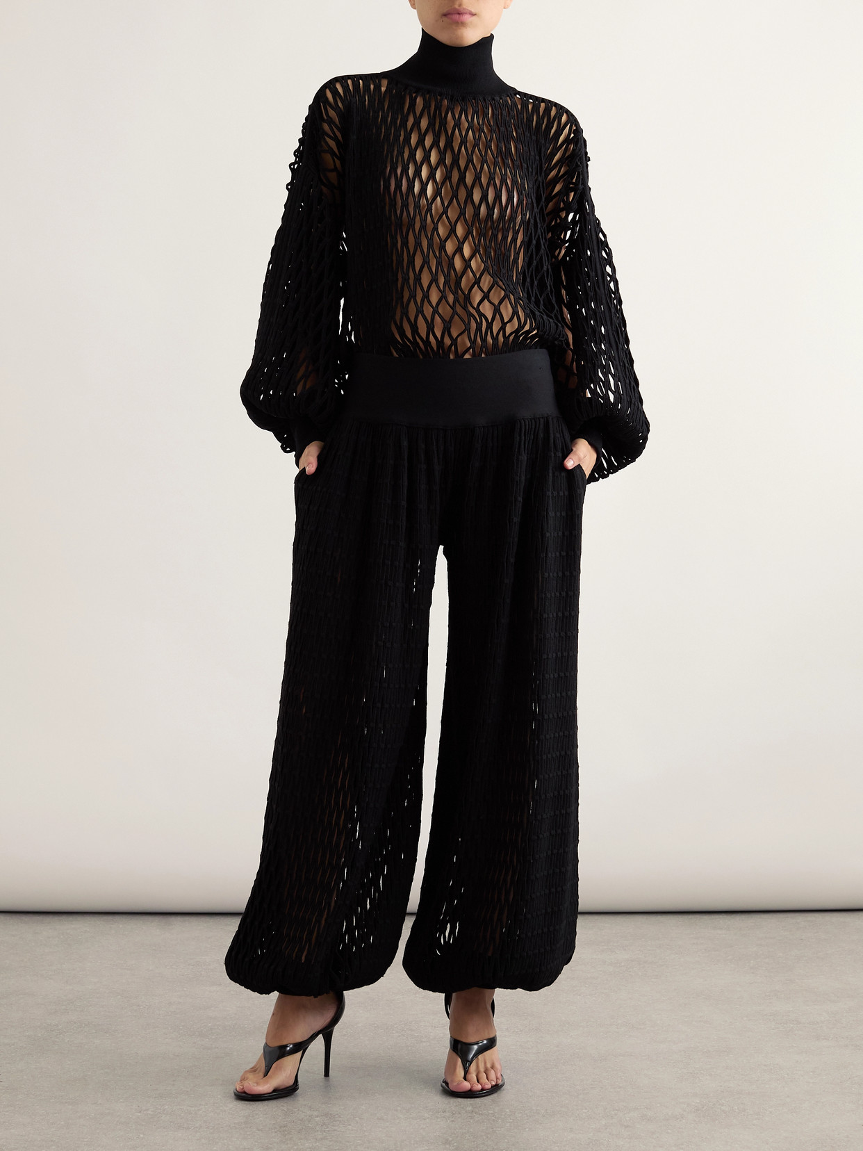 ALAÏA OVERSIZED OPEN-KNIT TURTLENECK SWEATER