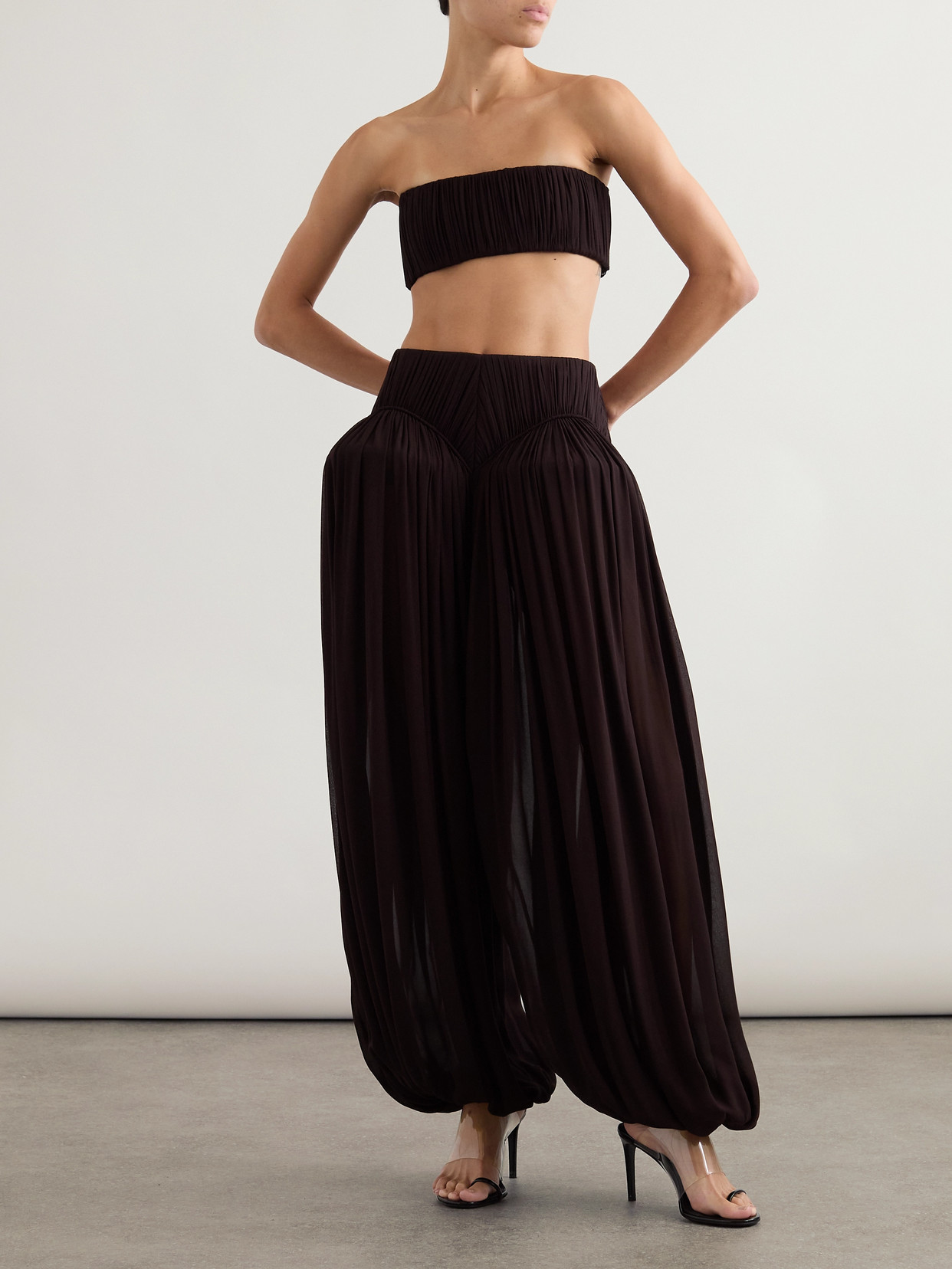 Alaïa Pleated Crepe Tapered Pants In Brown