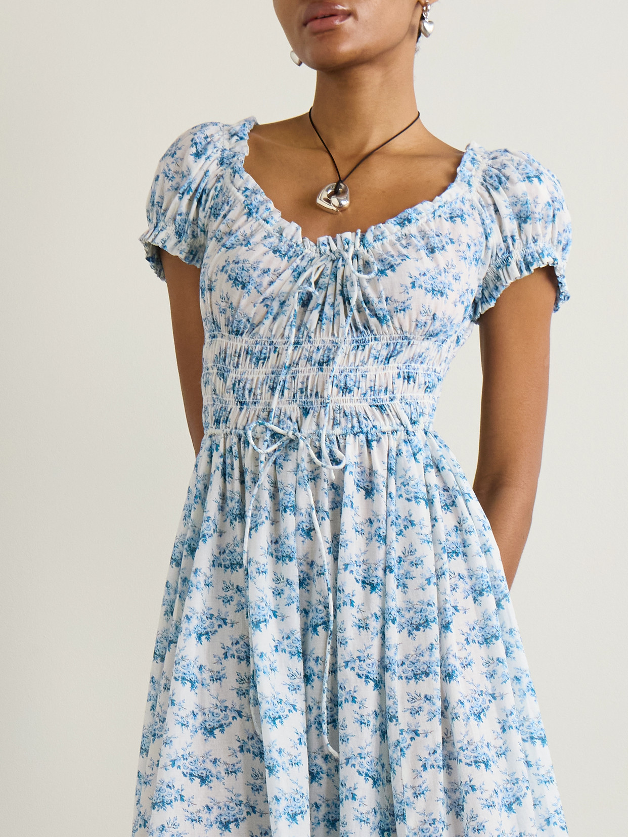 DOEN ASHLYNN TIE-DETAILED SHIRRED FLORAL-PRINT ORGANIC COTTON-VOILE MIDI DRESS