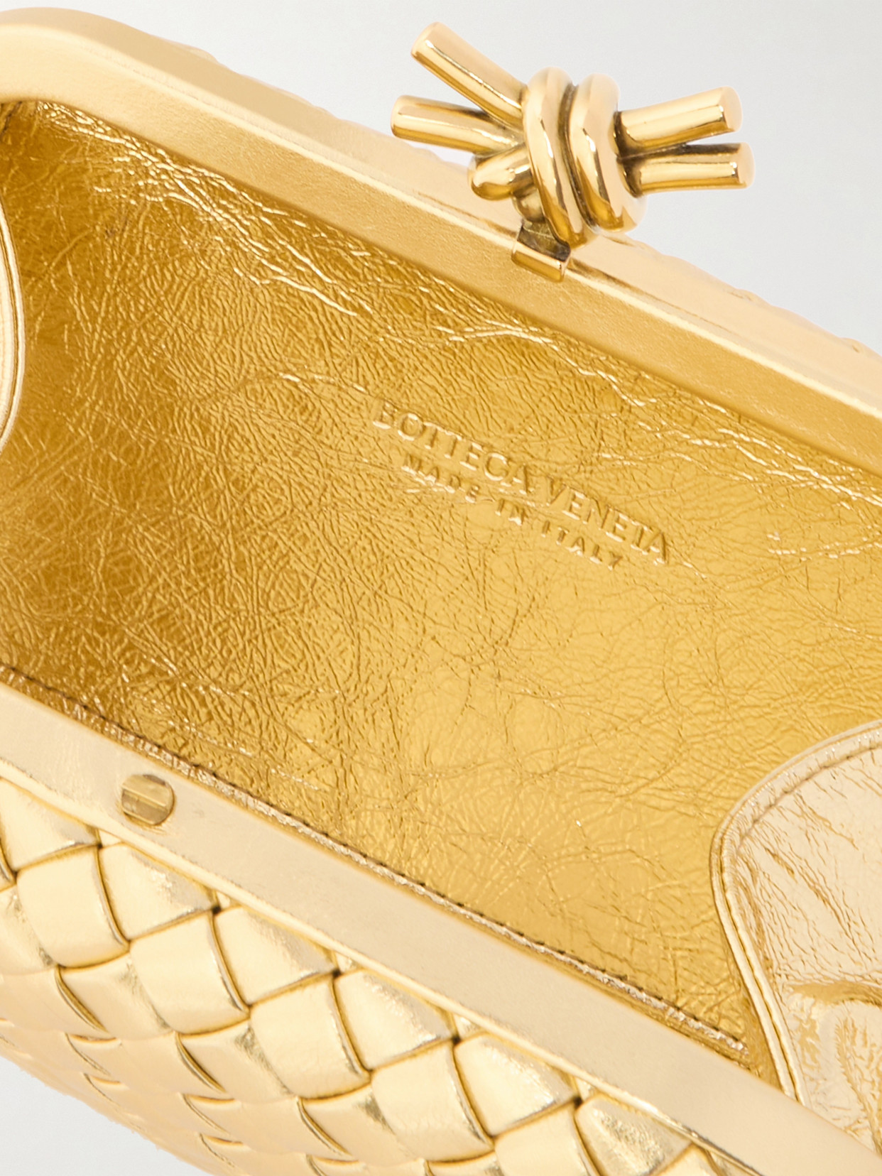 Shop Bottega Veneta Knot Padded Intrecciato Metallic Leather Clutch In Gold