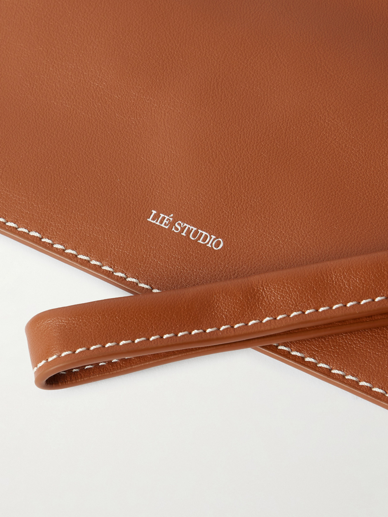 Lie Studio The Charlie Clutch Bag In Brown