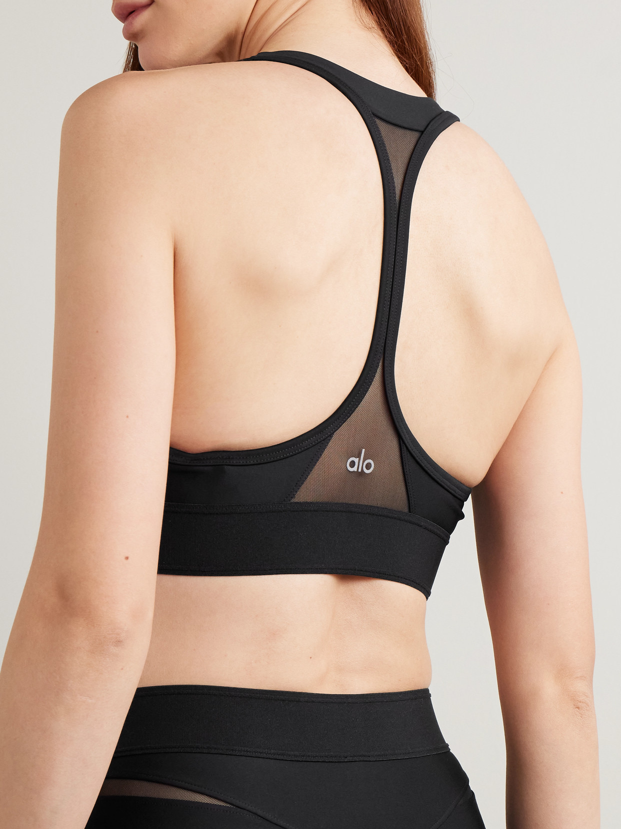 Shop Alo Yoga Rebel Mesh-trimmed Airlift Sports Bra In Black