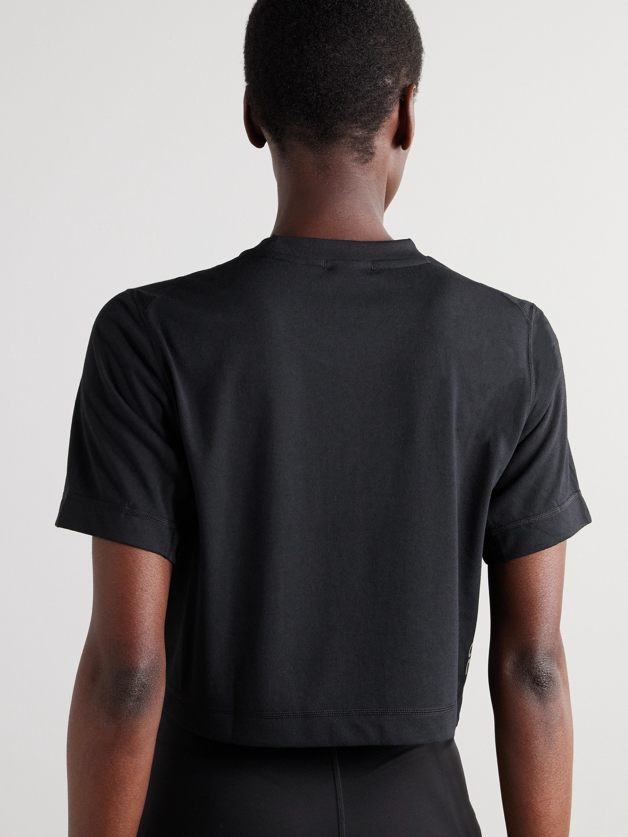 On Train Cropped Recycled-jersey T-shirt In Black