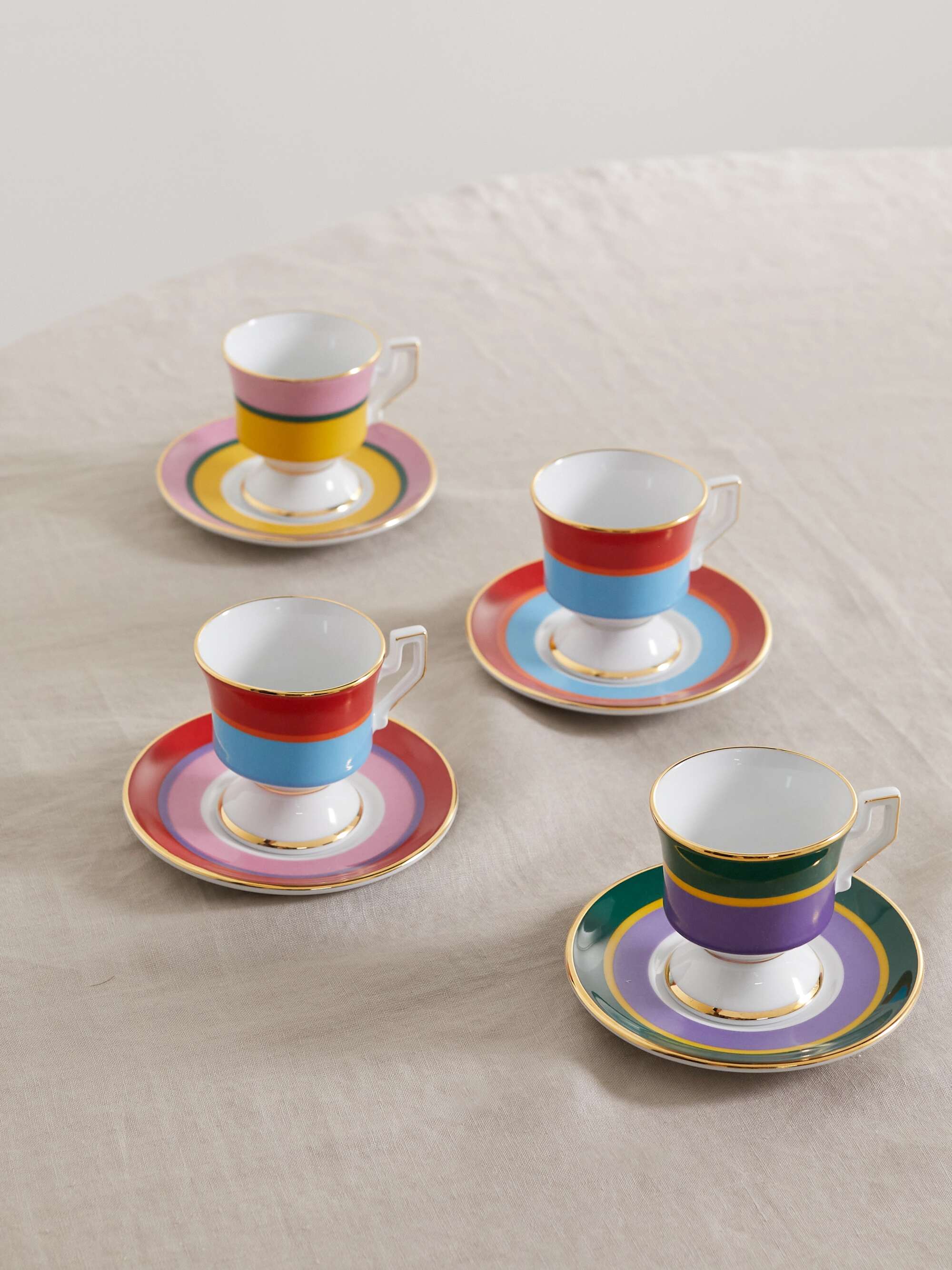 Set of four gold-plated porcelain espresso cups and saucers