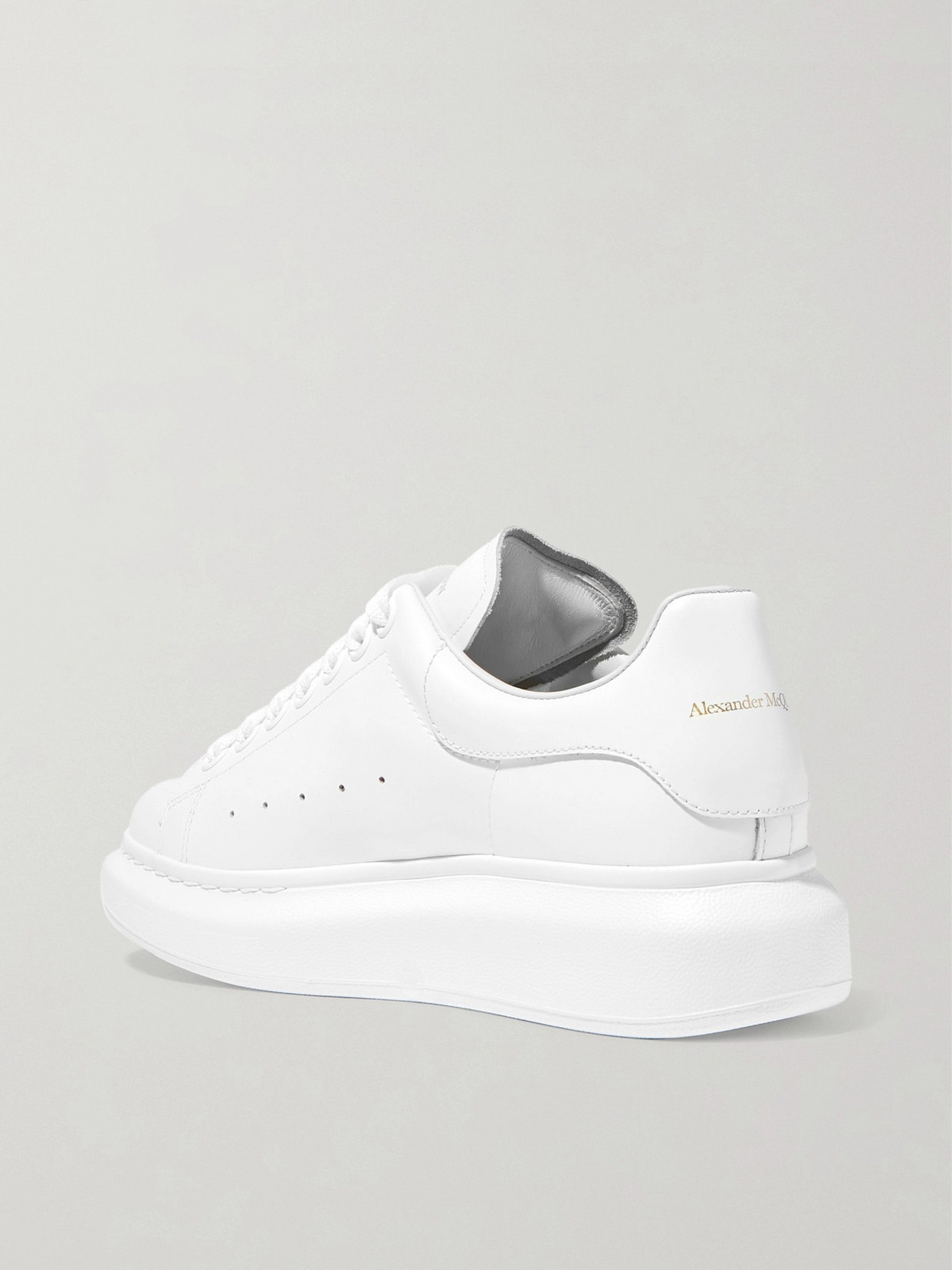 Shop Alexander Mcqueen Leather Exaggerated-sole Sneakers In White