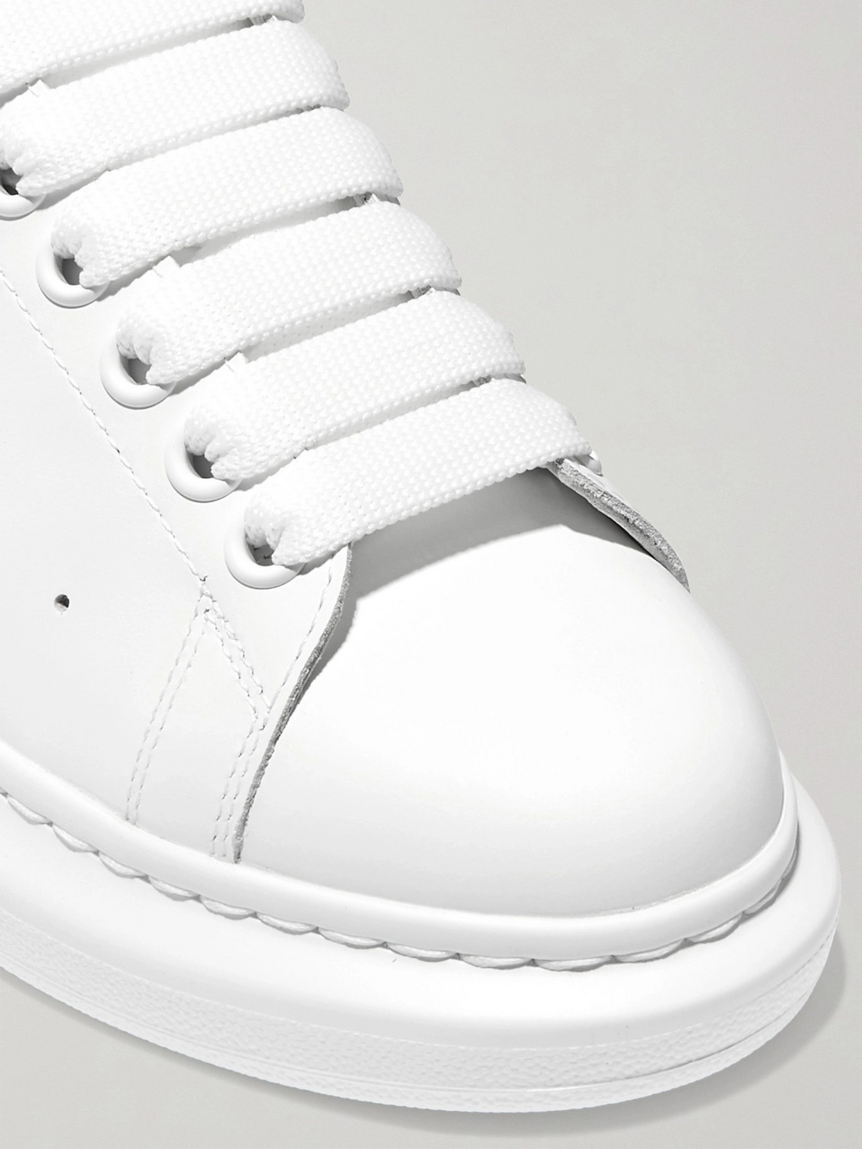 Shop Alexander Mcqueen Leather Exaggerated-sole Sneakers In White