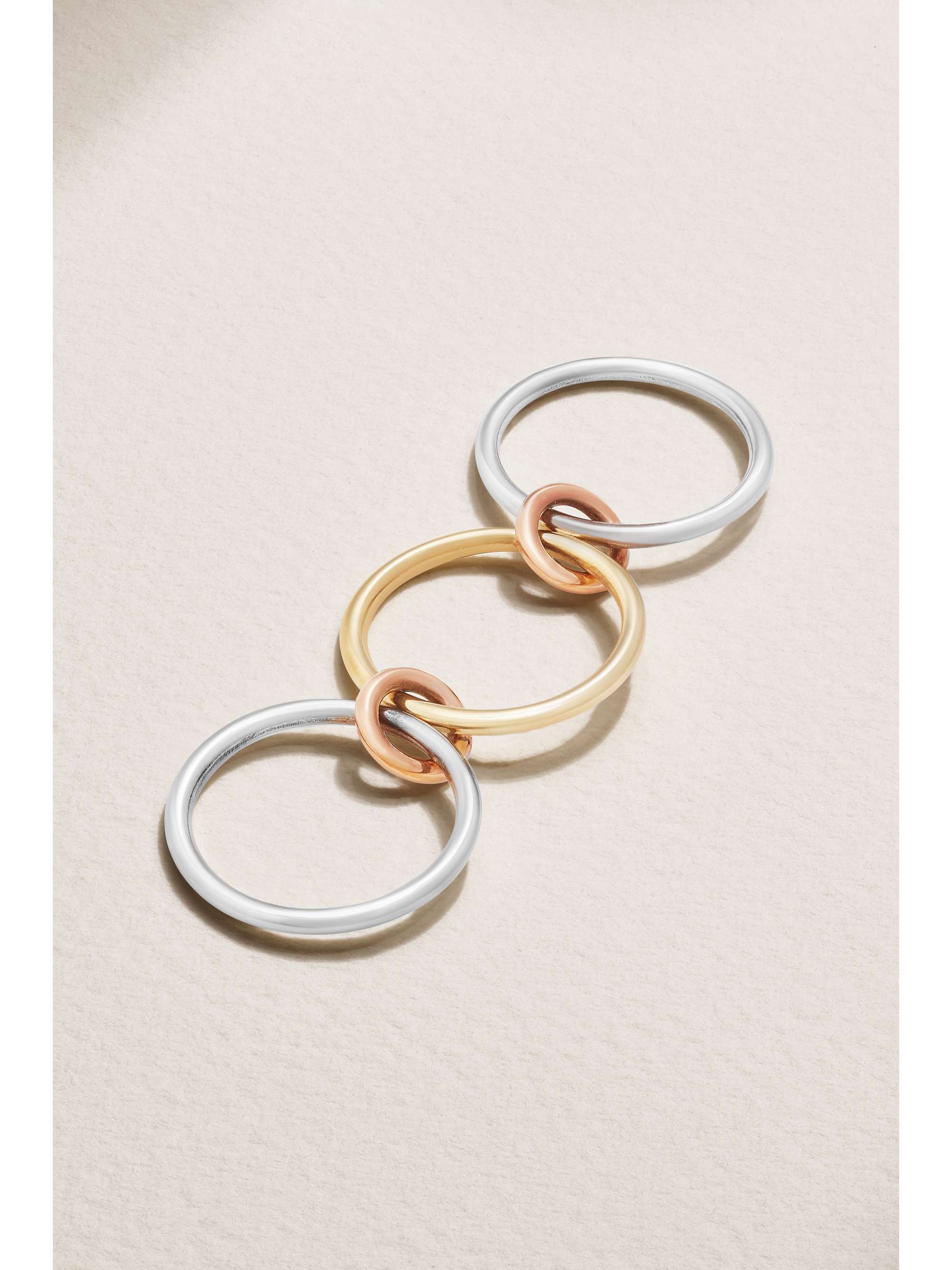 SPINELLI KILCOLLIN Solarium set of three 18-karat yellow and rose gold and sterling silver rings