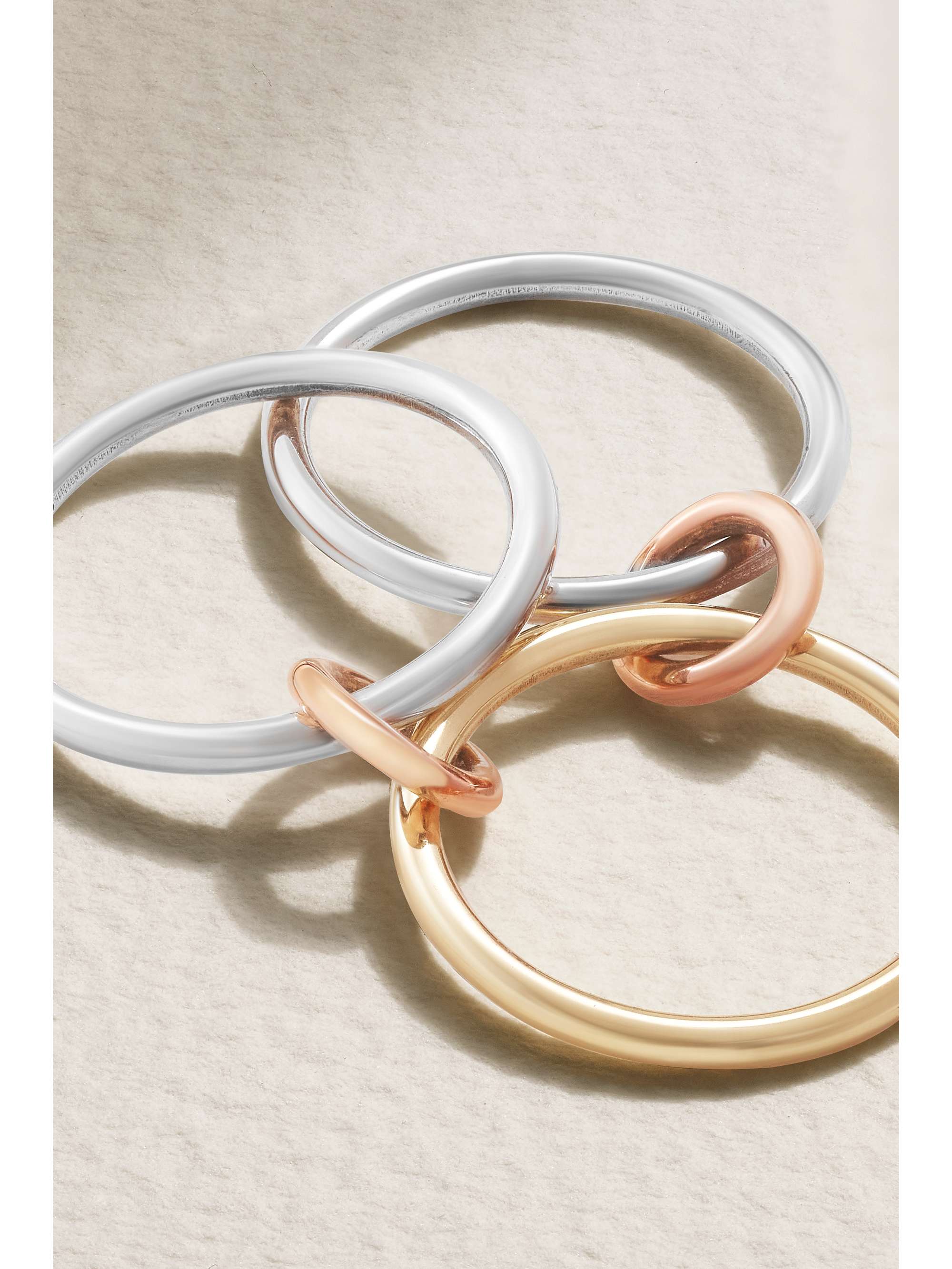 SPINELLI KILCOLLIN Solarium set of three 18-karat yellow and rose gold and sterling silver rings