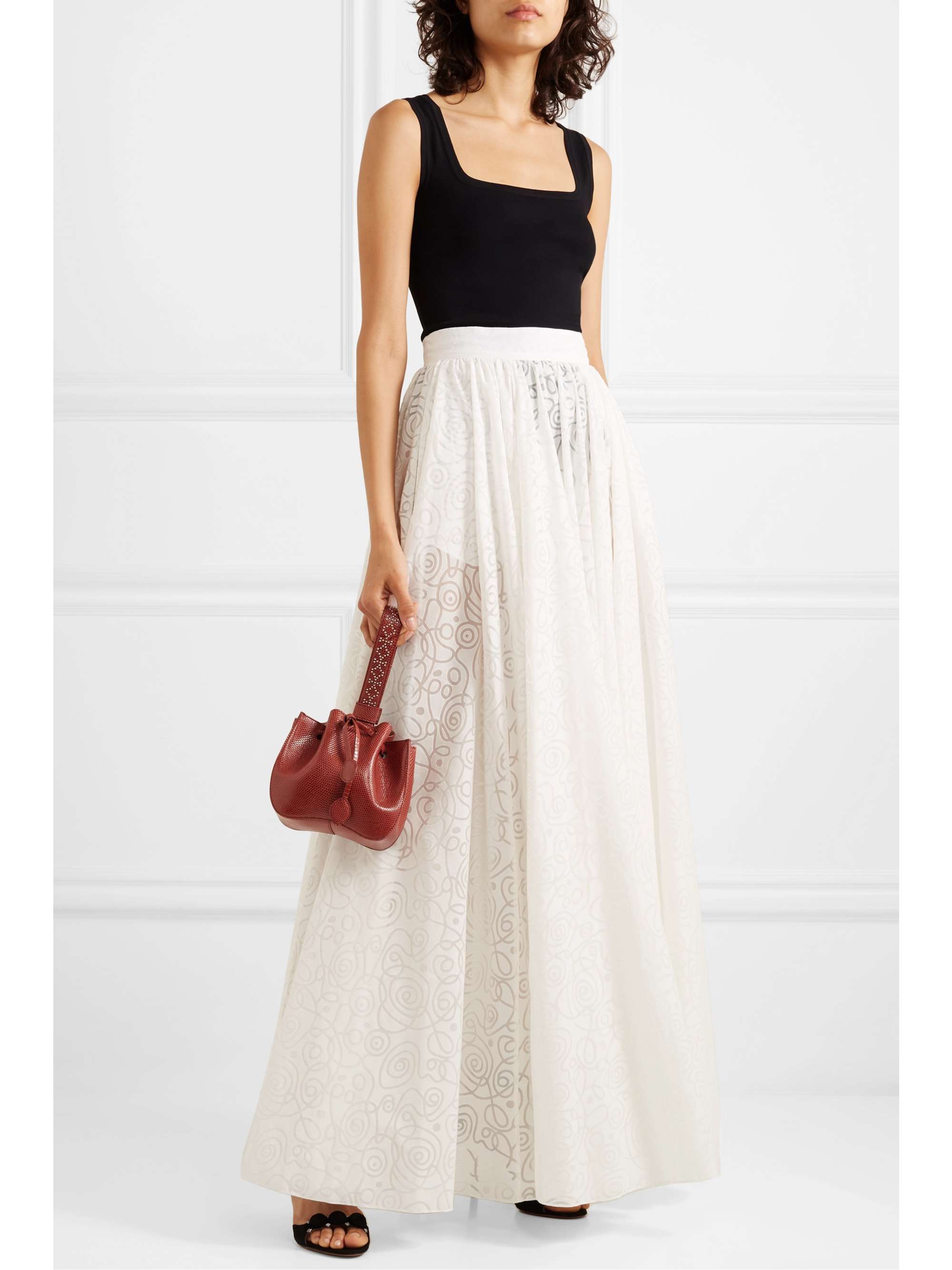 ALAÏA Small studded lizard bucket bag