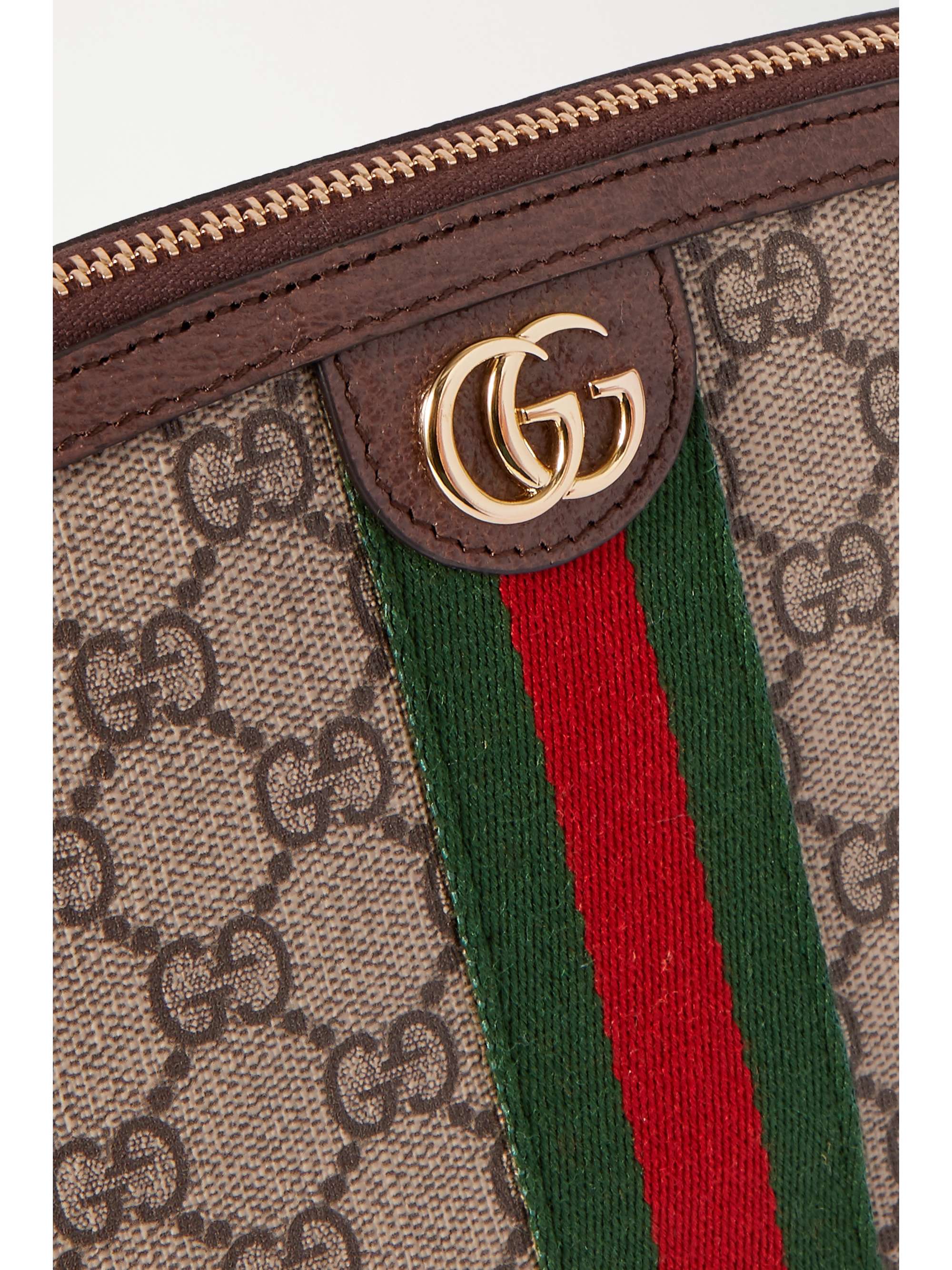 GUCCI Trousse à maquillage en toile enduite imprimée à finitions en cuir
