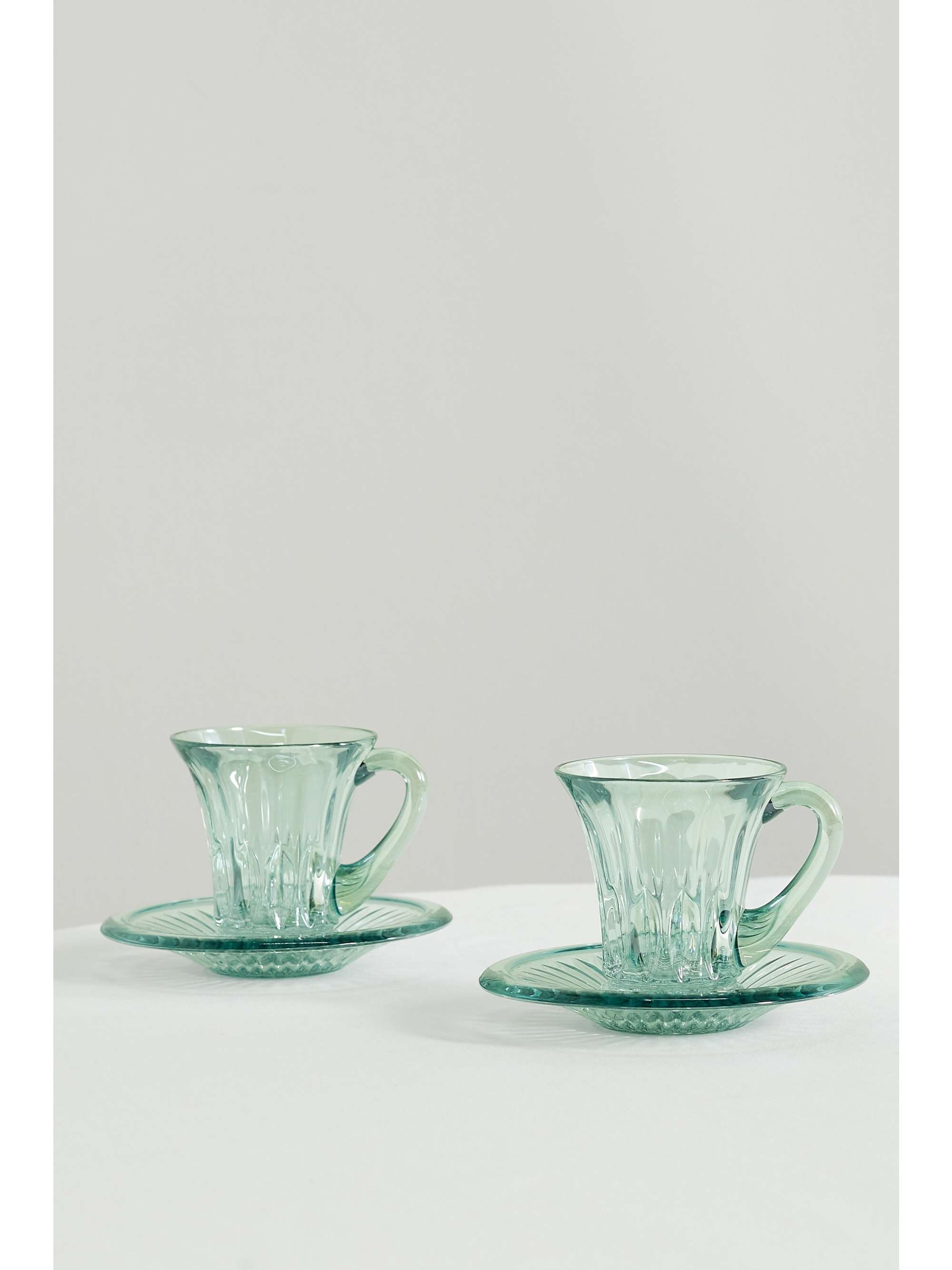 LUISA BECCARIA Set of two iridescent glass tea cups and saucers