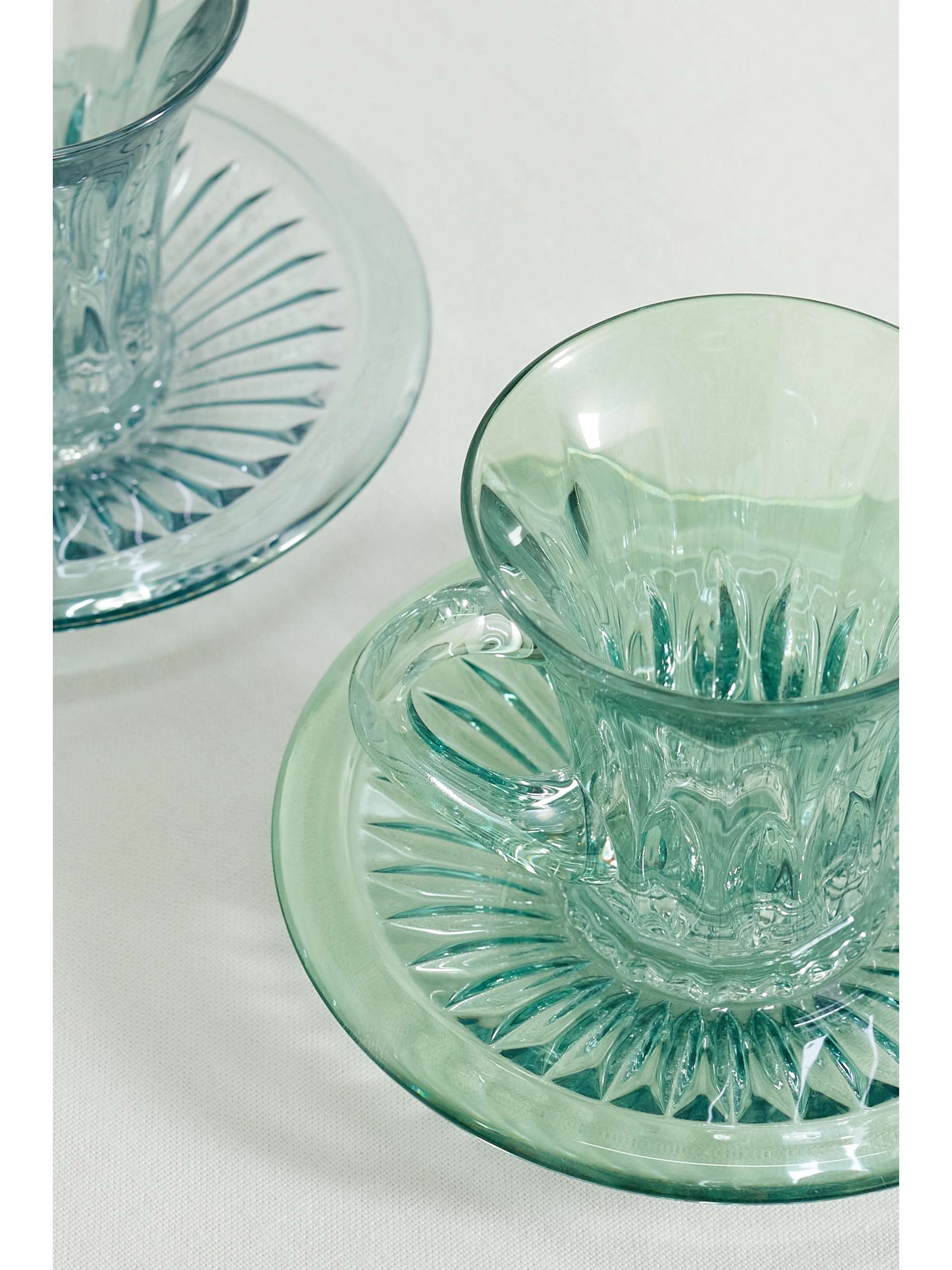 LUISA BECCARIA Set of two iridescent glass tea cups and saucers