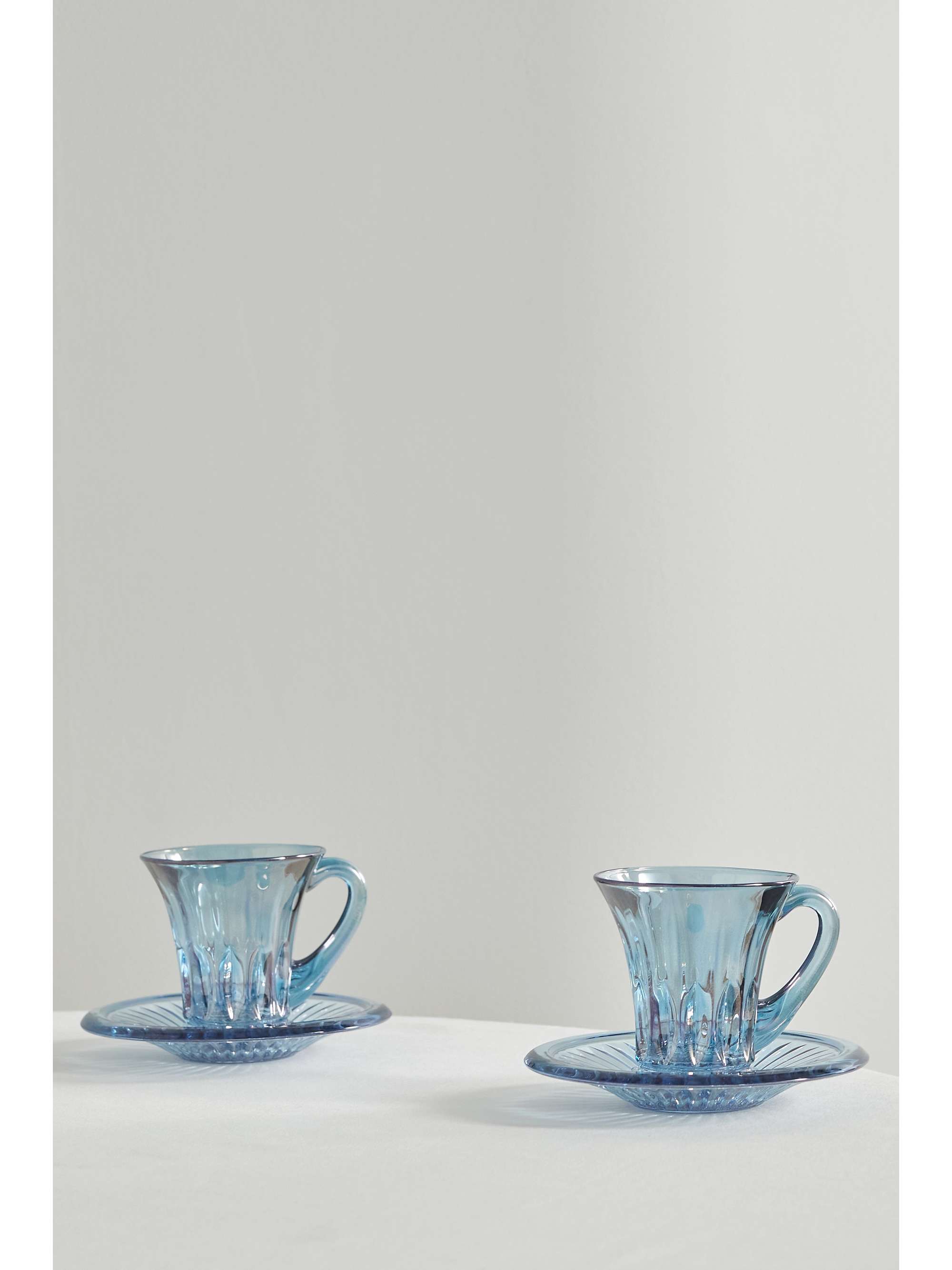 LUISA BECCARIA Set of two iridescent glass tea cups and saucers