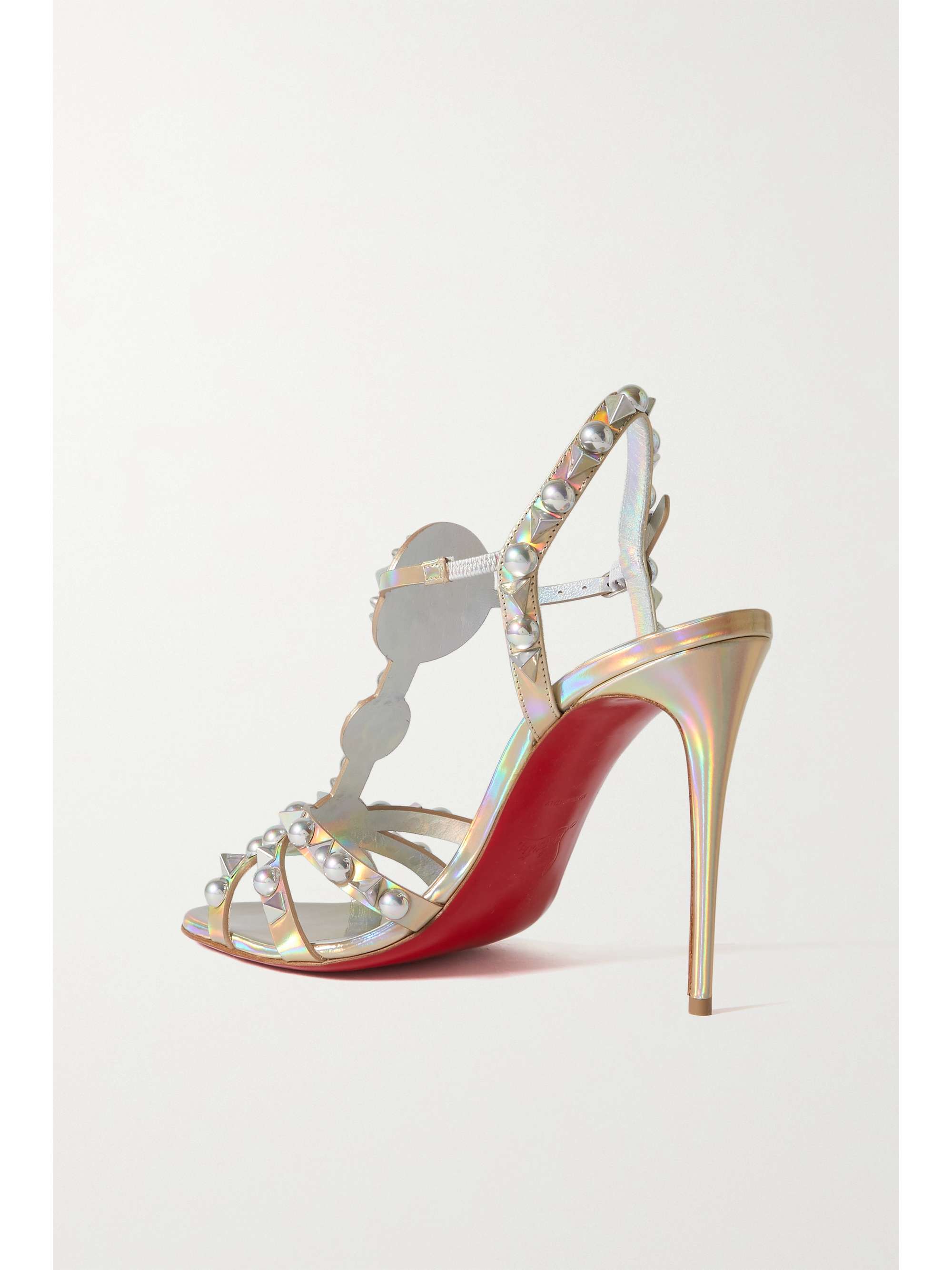 CHRISTIAN LOUBOUTIN صندل Goldora من جلد لامع مزيّن بدبابيس معدنية مع كعب بارتفاع 100 مم