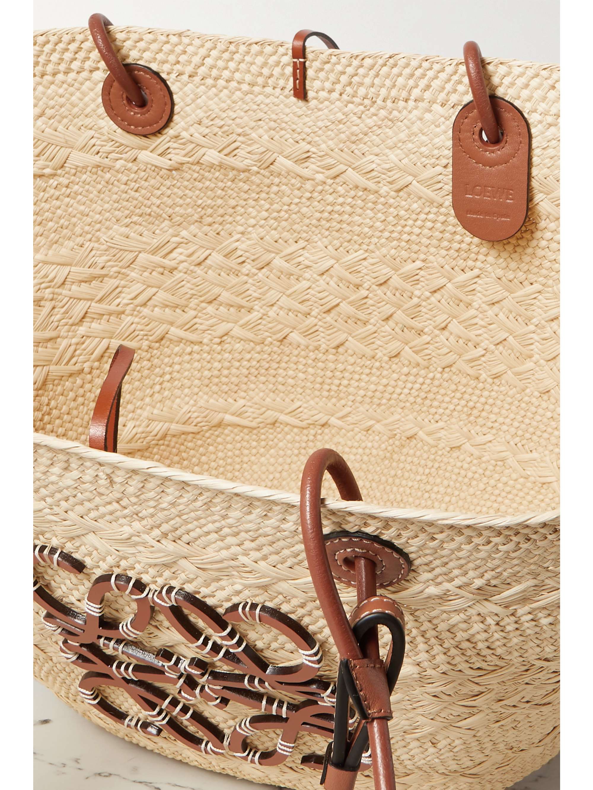 Loewe Paulas Ibiza Pochette Small Med Striped Raffia Shoulder Bag, $455, NET-A-PORTER.COM