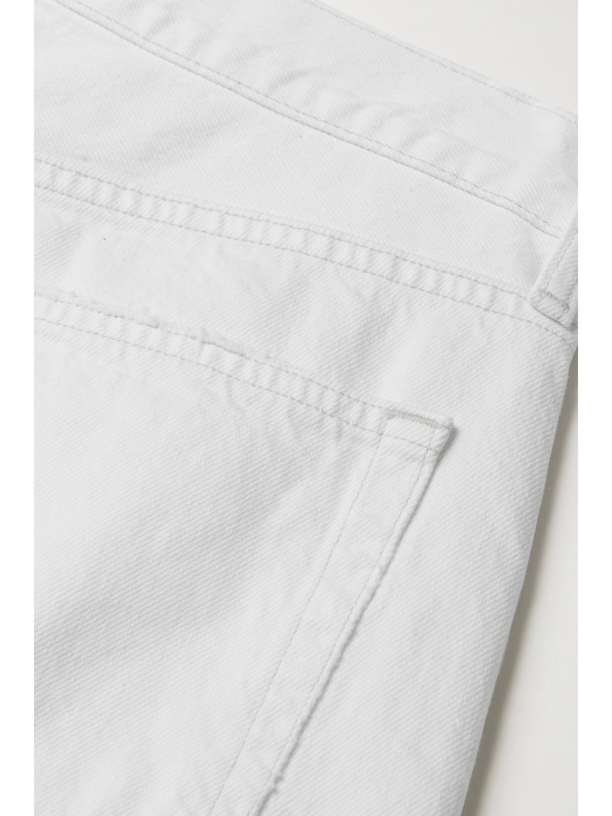 Shop Agolde Parker Long Distressed Denim Shorts In White